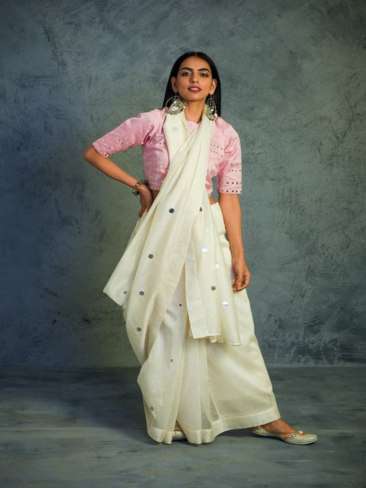 Chanderi Off-white Saree With Light Pink Blouse at Kamakhyaa by Charkhee. This item is Chanderi, Cotton, Embellished, Ethnic Wear, Indian Wear, Mirror Work, Natural, Pink, Relaxed Fit, Saree Sets, Tyohaar, White, Womenswear