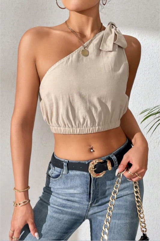 Cropped One-Shoulder Striped Tie Shoulder Tank at Kamakhyaa by Trendsi. This item is 100% cotton, Beige, Crop Tops, Natural, One Shoulder Tops, Regular Fit, Shipping Delay 09/29/2023 - 10/04/2023, Solids, Trendsi, Womenswear