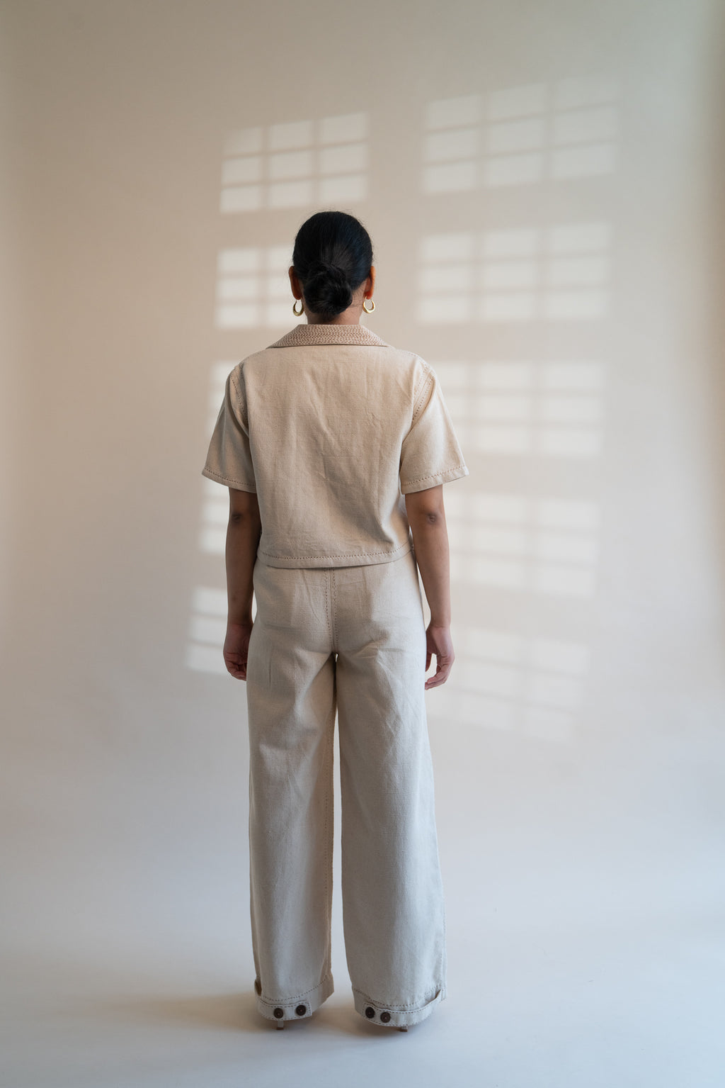 Dawning Denim Crop Jacket & Patch Pocket Pants Set at Kamakhyaa by Lafaani. This item is Beige, Casual Wear, Co-ord Sets, Denim, Embroidered, Hand Woven Cotton, Kora, Natural, Office, Office Wear Co-ords, Regular Fit, Womenswear