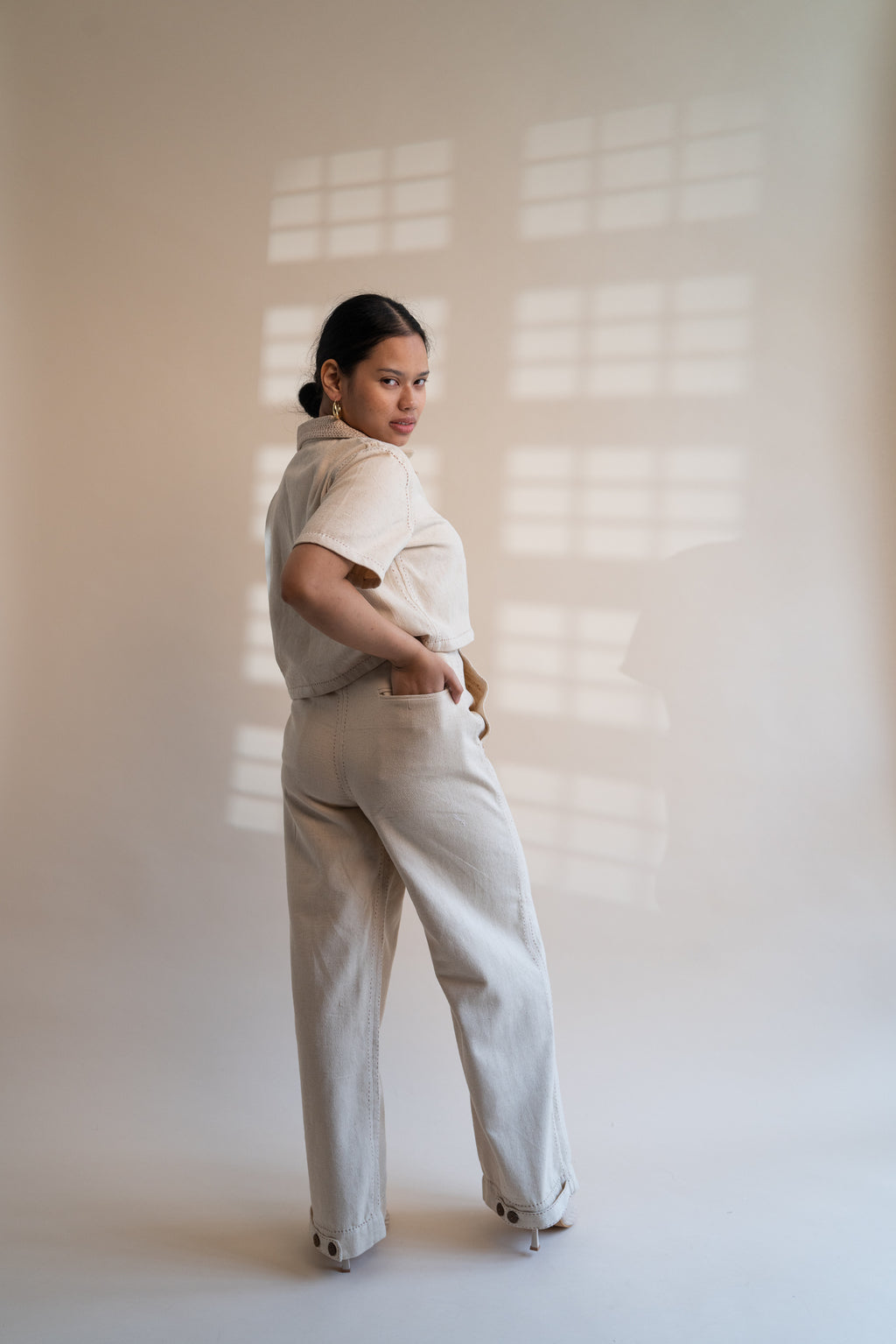 Dawning Denim Crop Jacket & Patch Pocket Pants Set at Kamakhyaa by Lafaani. This item is Beige, Casual Wear, Co-ord Sets, Denim, Embroidered, Hand Woven Cotton, Kora, Natural, Office, Office Wear Co-ords, Regular Fit, Womenswear