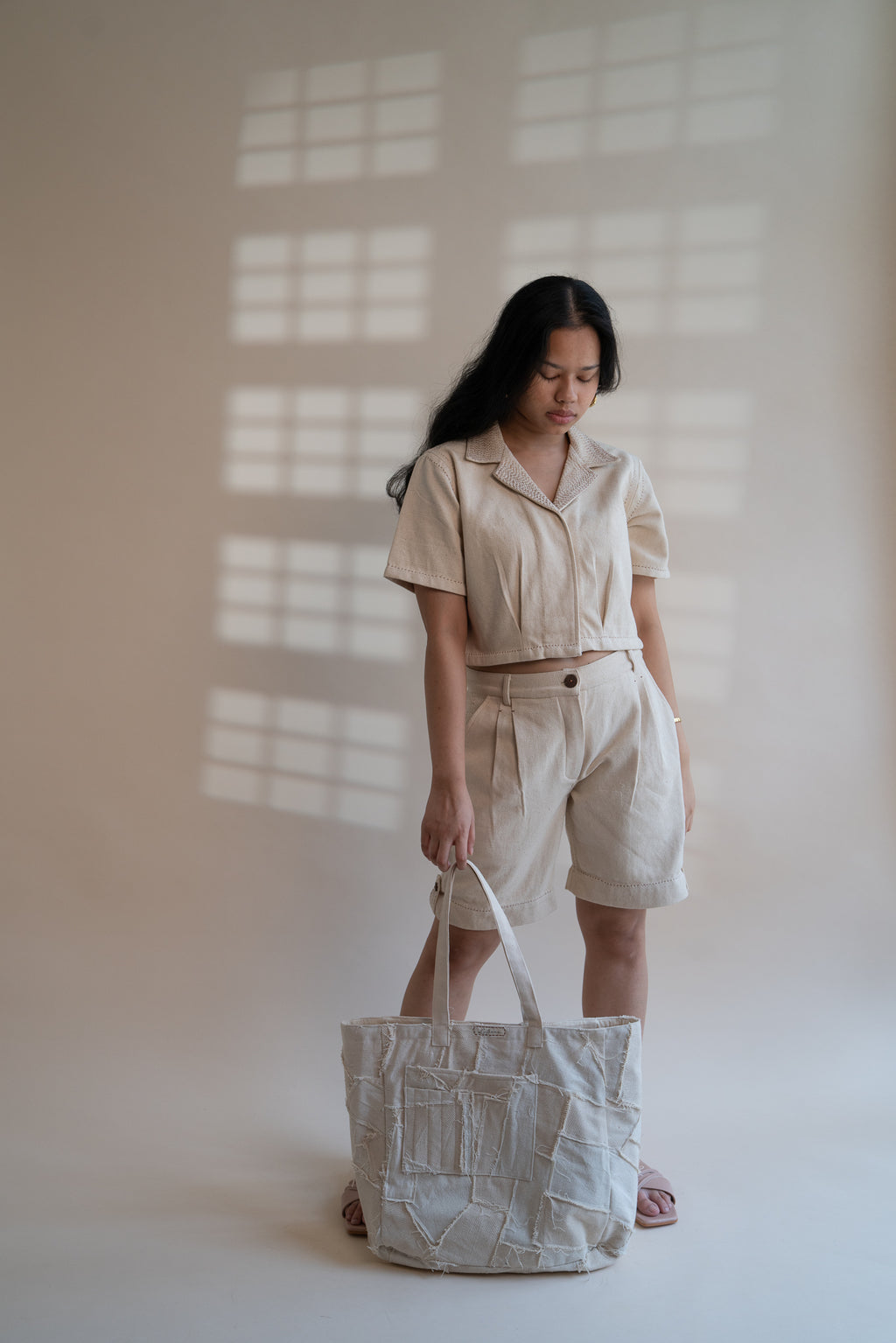 Dawning Denim Crop Jacket & Shorts Set at Kamakhyaa by Lafaani. This item is Beige, Casual Wear, Co-ord Sets, Denim, Embroidered, Hand Woven Cotton, Kora, Natural, Regular Fit, Travel, Travel Co-ords, Womenswear