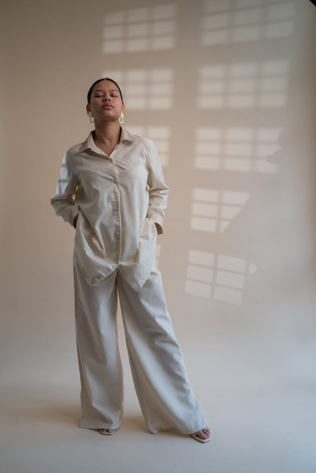 Dawning Draped Shirt at Kamakhyaa by Lafaani. This item is Beige, Casual Wear, Denim, Embroidered, Hand Woven Cotton, Kora, Natural, Relaxed Fit, Tops, Womenswear, Wrap Tops