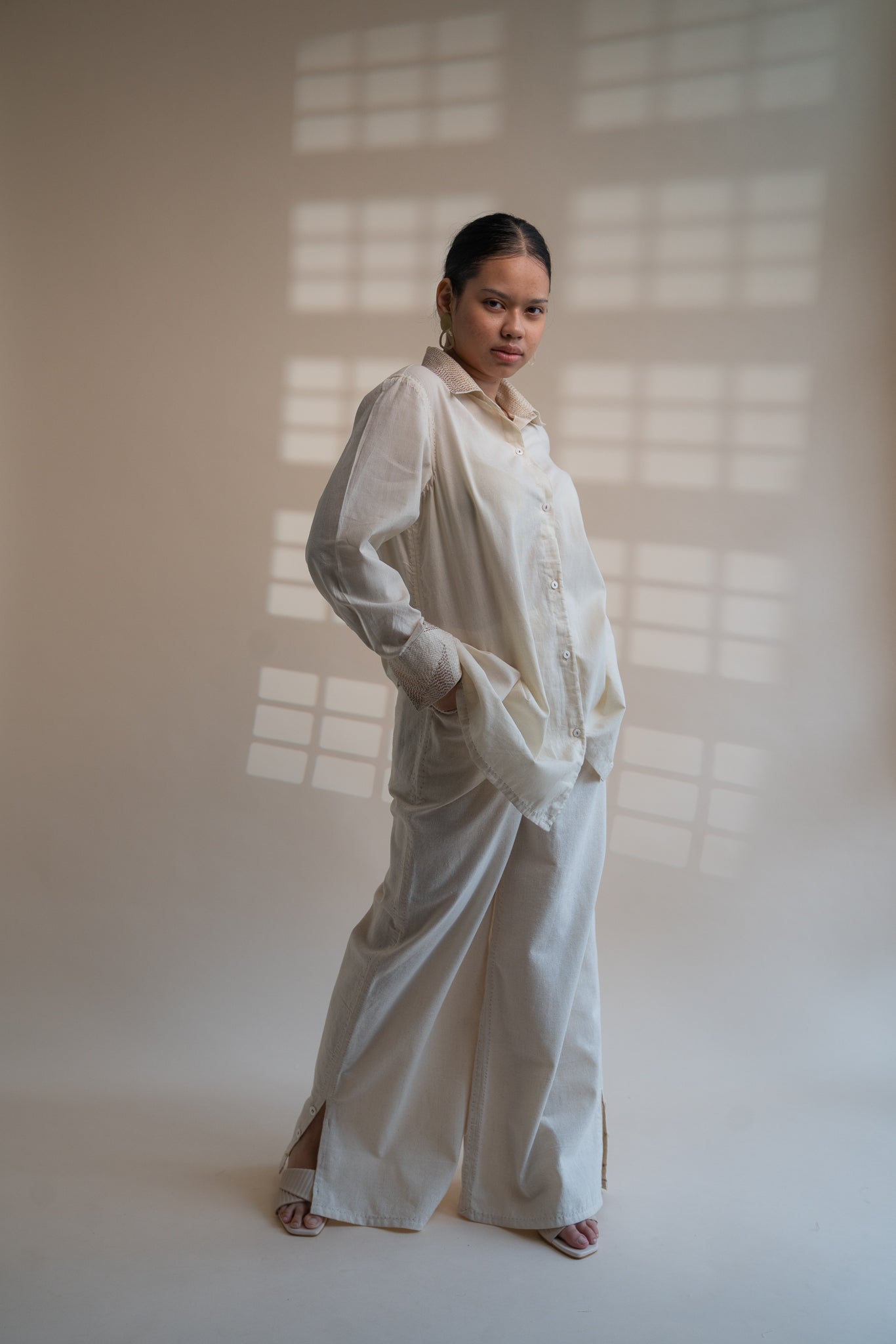 Dawning Draped Shirt at Kamakhyaa by Lafaani. This item is Beige, Casual Wear, Denim, Embroidered, Hand Woven Cotton, Kora, Natural, Relaxed Fit, Tops, Womenswear, Wrap Tops