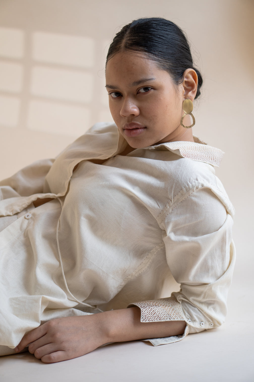 Dawning Draped Shirt at Kamakhyaa by Lafaani. This item is Beige, Casual Wear, Denim, Embroidered, Hand Woven Cotton, Kora, Natural, Relaxed Fit, Tops, Womenswear, Wrap Tops