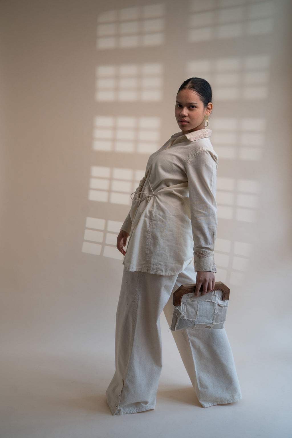 Dawning Draped Shirt at Kamakhyaa by Lafaani. This item is Beige, Casual Wear, Denim, Embroidered, Hand Woven Cotton, Kora, Natural, Relaxed Fit, Tops, Womenswear, Wrap Tops