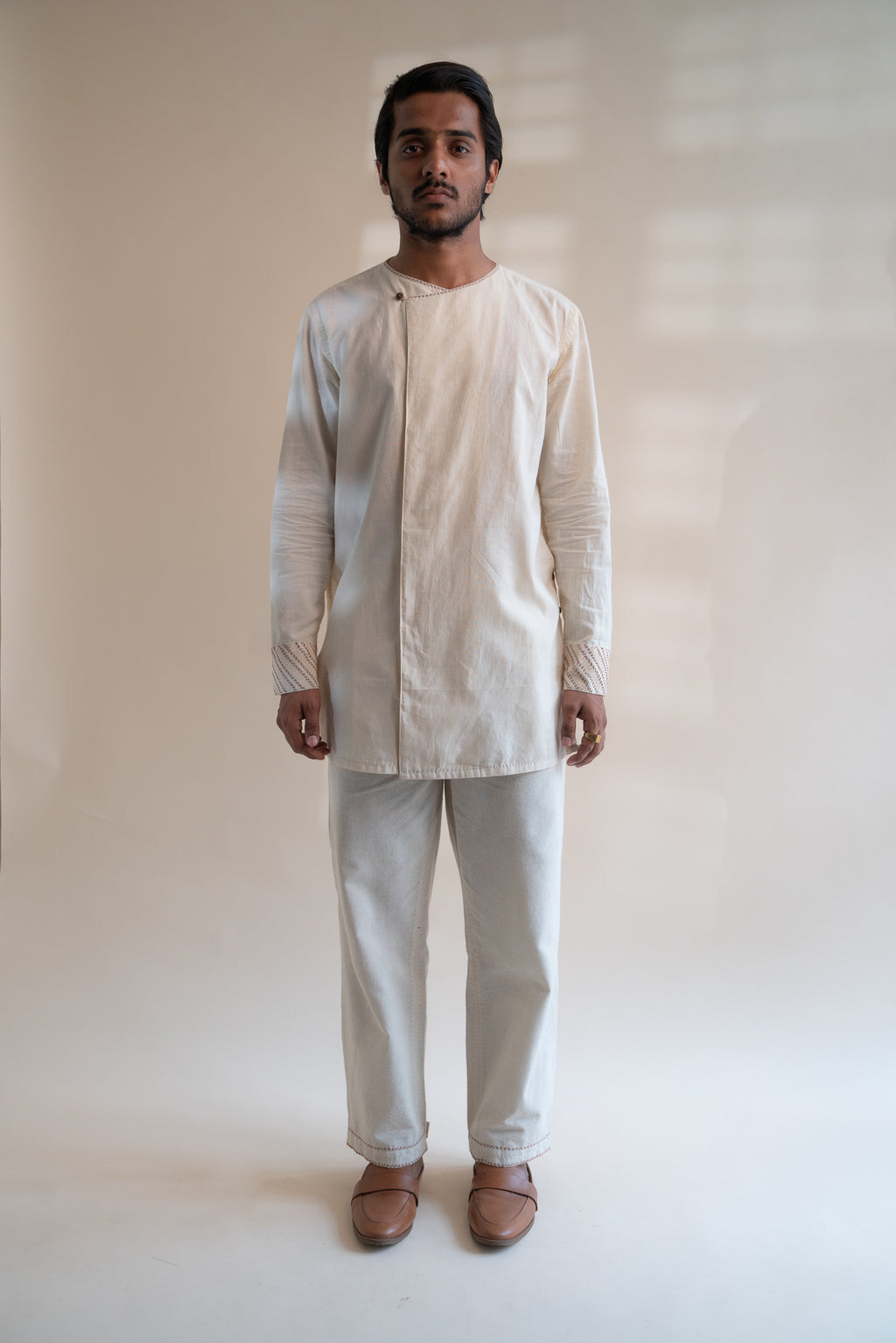 Dawning Pleated Pants at kamakhyaa.com by Lafaani. This item is 100% Cotton, Beige, Casual Wear, Clothing by Lafaani, Dawning by Lafaani, Denim, Embroidered, For Father, For Him, Handwoven Cotton, Kora, Men Shirts, Menswear, Natural, Rakhi Special, Regular Fit, Shirts, Tops, Under $200