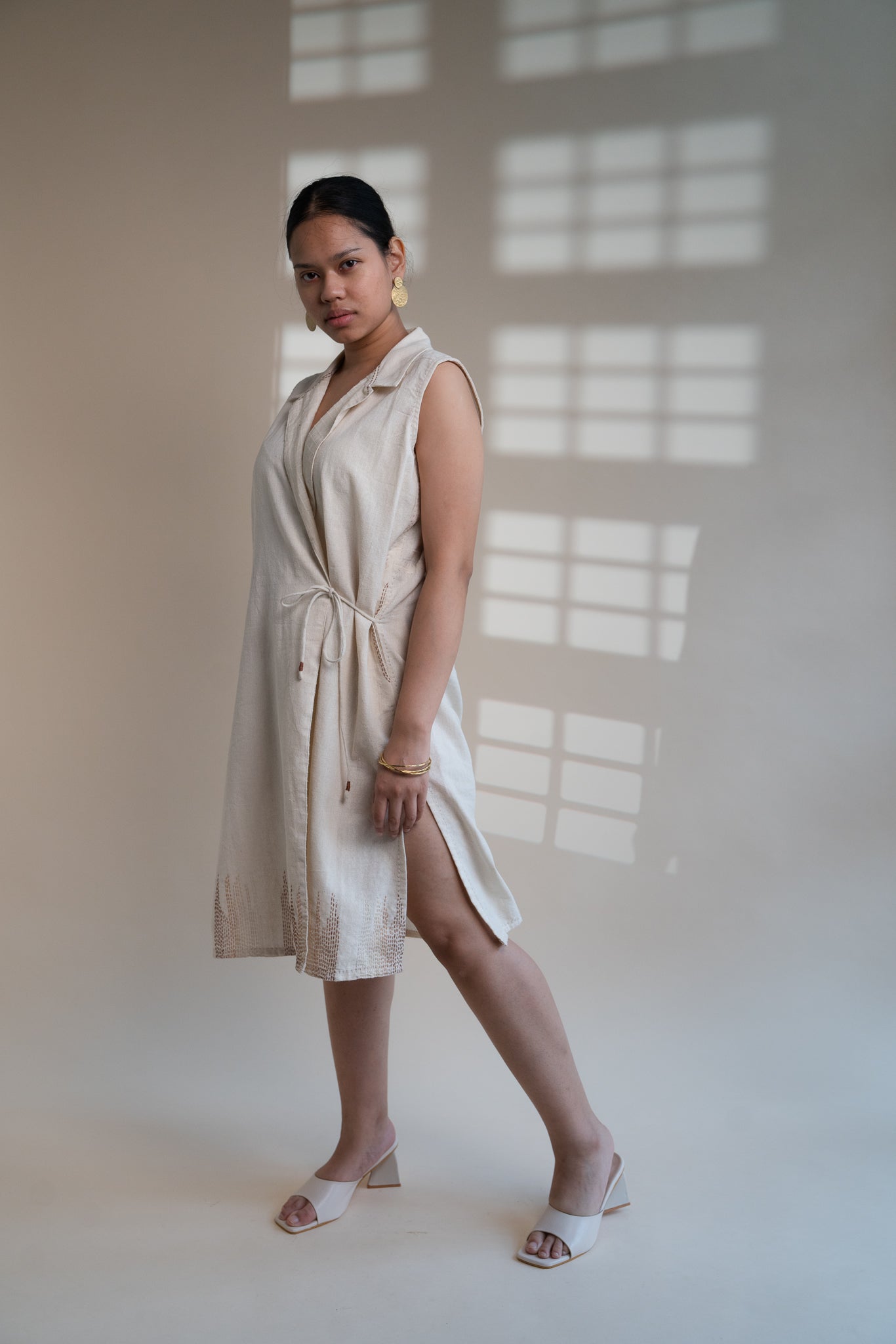 Dawning Tie Up Dress at Kamakhyaa by Lafaani. This item is Beige, Casual Wear, Denim, Embroidered, Hand Woven Cotton, Kora, Natural, Regular Fit, Womenswear, Wrap Dresses