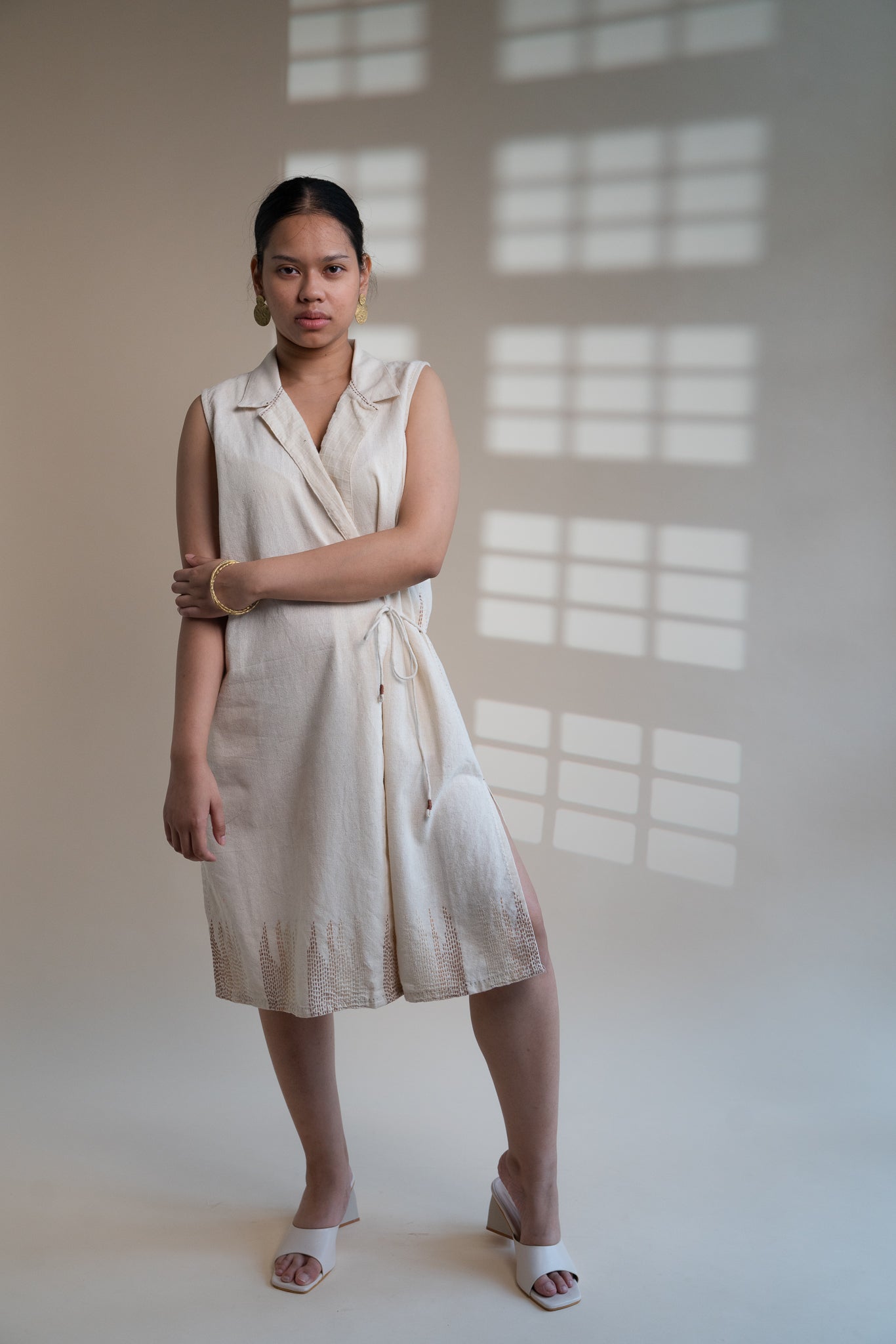 Dawning Tie Up Dress at Kamakhyaa by Lafaani. This item is Beige, Casual Wear, Denim, Embroidered, Hand Woven Cotton, Kora, Natural, Regular Fit, Womenswear, Wrap Dresses