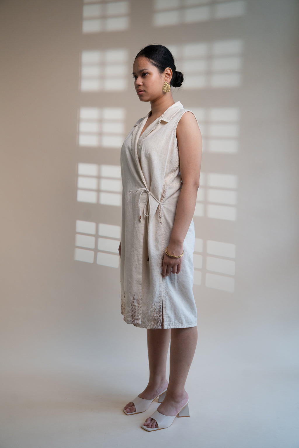 Dawning Tie Up Dress at Kamakhyaa by Lafaani. This item is Beige, Casual Wear, Denim, Embroidered, Hand Woven Cotton, Kora, Natural, Regular Fit, Womenswear, Wrap Dresses