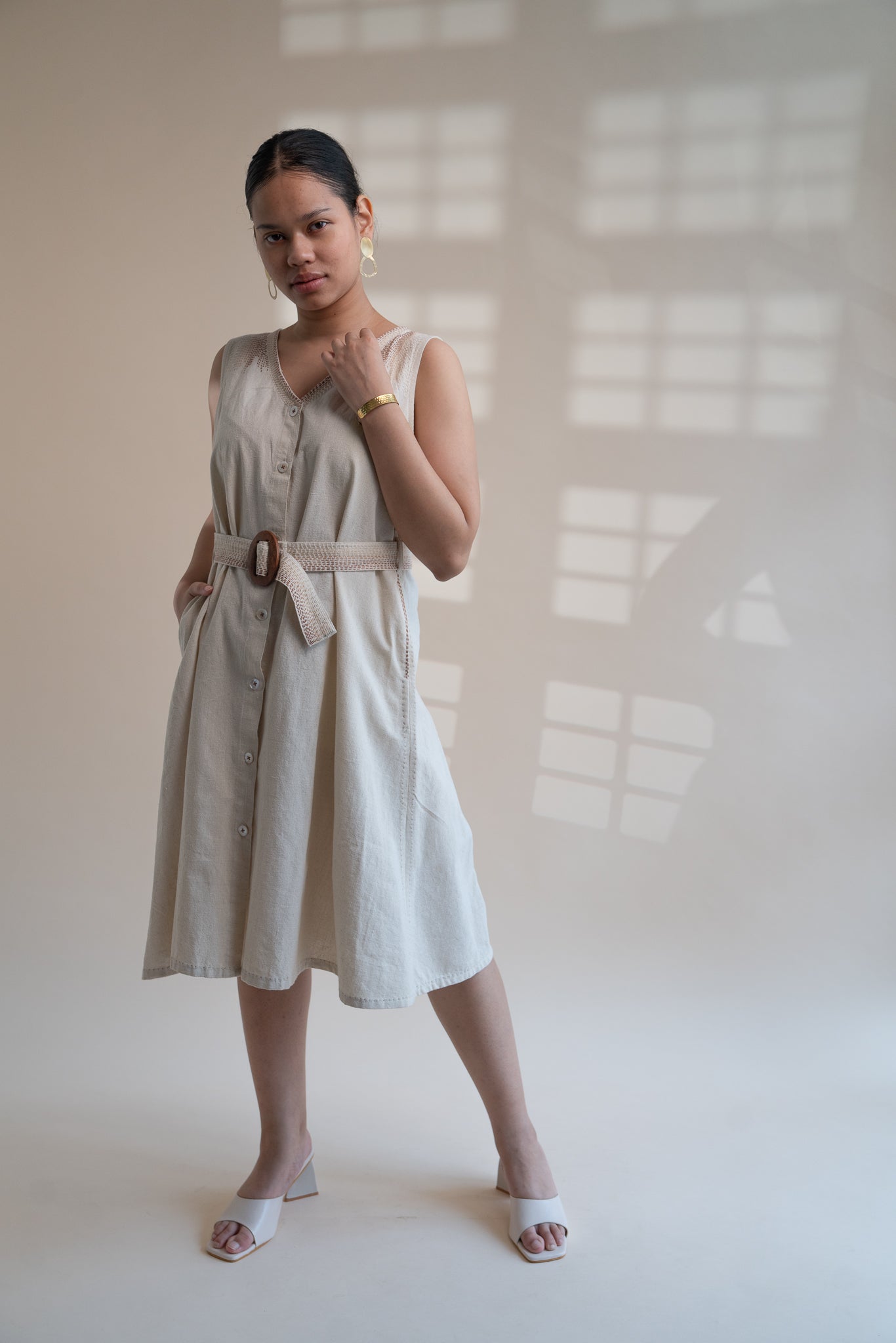 Dawning Trench Dress at Kamakhyaa by Lafaani. This item is Beige, Casual Wear, Denim, Embroidered, Hand Woven Cotton, Kora, Midi Dresses, Natural, Regular Fit, Sleeveless Dresses, Womenswear