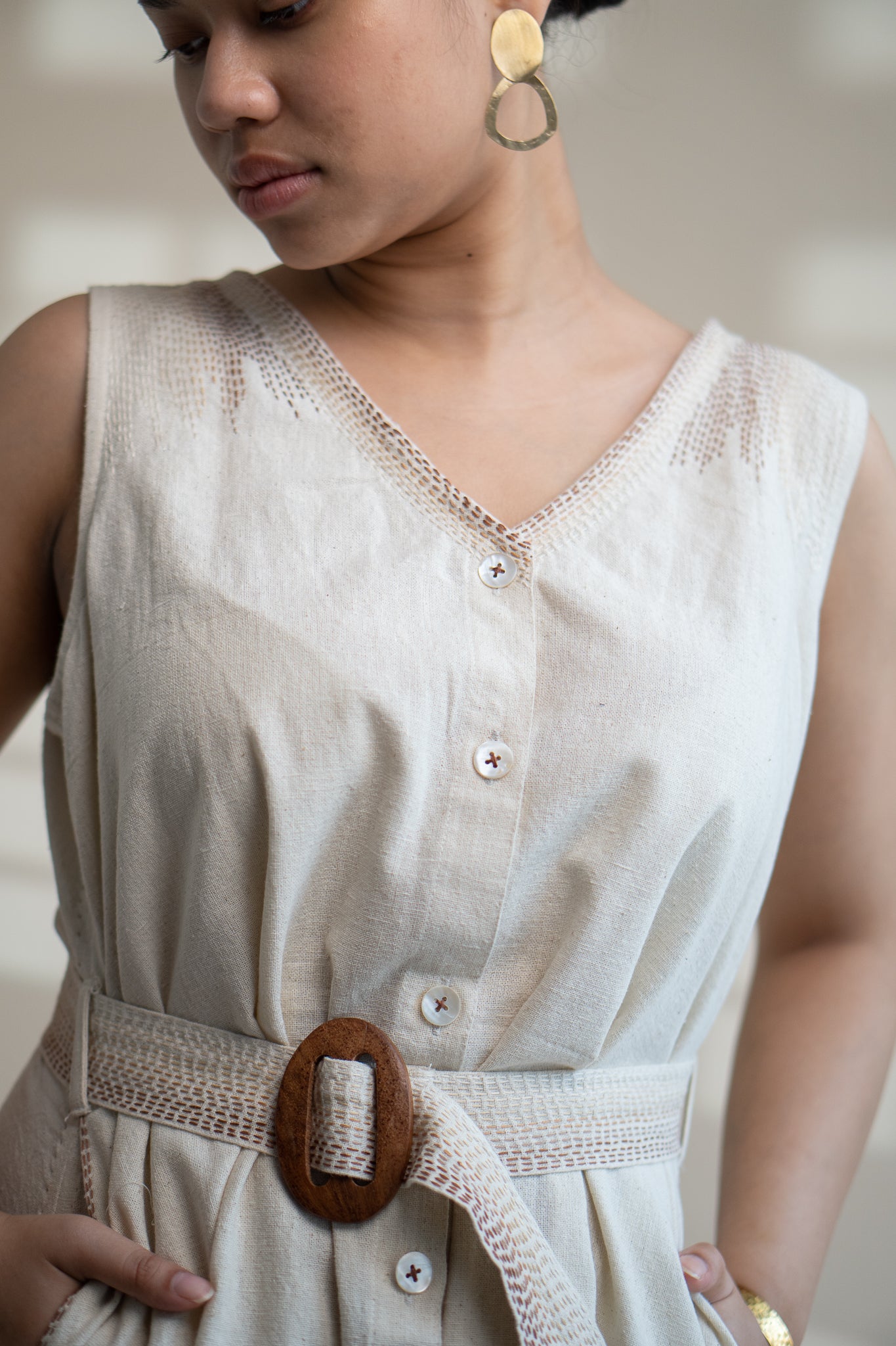 Dawning Trench Dress at Kamakhyaa by Lafaani. This item is Beige, Casual Wear, Denim, Embroidered, Hand Woven Cotton, Kora, Midi Dresses, Natural, Regular Fit, Sleeveless Dresses, Womenswear