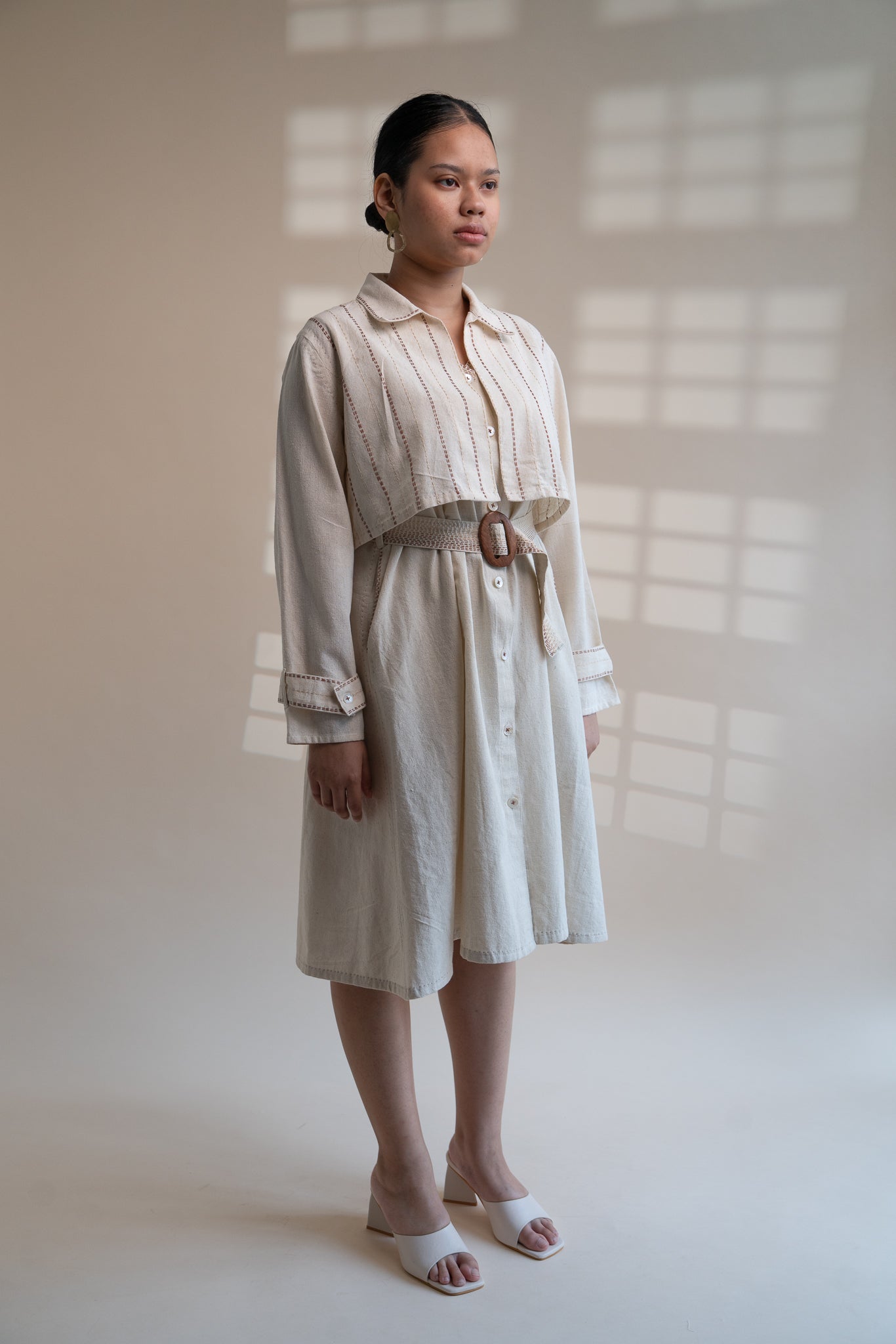 Dawning Trench Dress with Cropped Jacket at Kamakhyaa by Lafaani. This item is Beige, Casual Wear, Co-ord Sets, Denim, Embroidered, Hand Woven Cotton, Kora, Natural, Regular Fit, Vacation, Vacation Co-ords, Womenswear