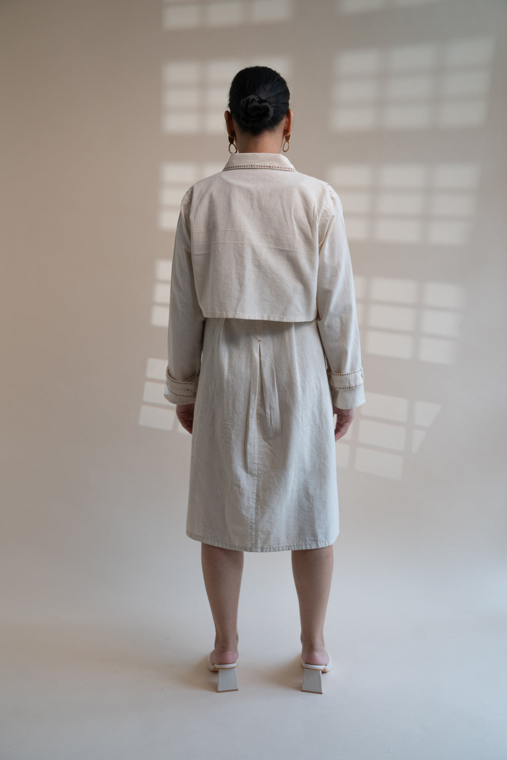 Dawning Trench Dress with Cropped Jacket at Kamakhyaa by Lafaani. This item is Beige, Casual Wear, Co-ord Sets, Denim, Embroidered, Hand Woven Cotton, Kora, Natural, Regular Fit, Vacation, Vacation Co-ords, Womenswear