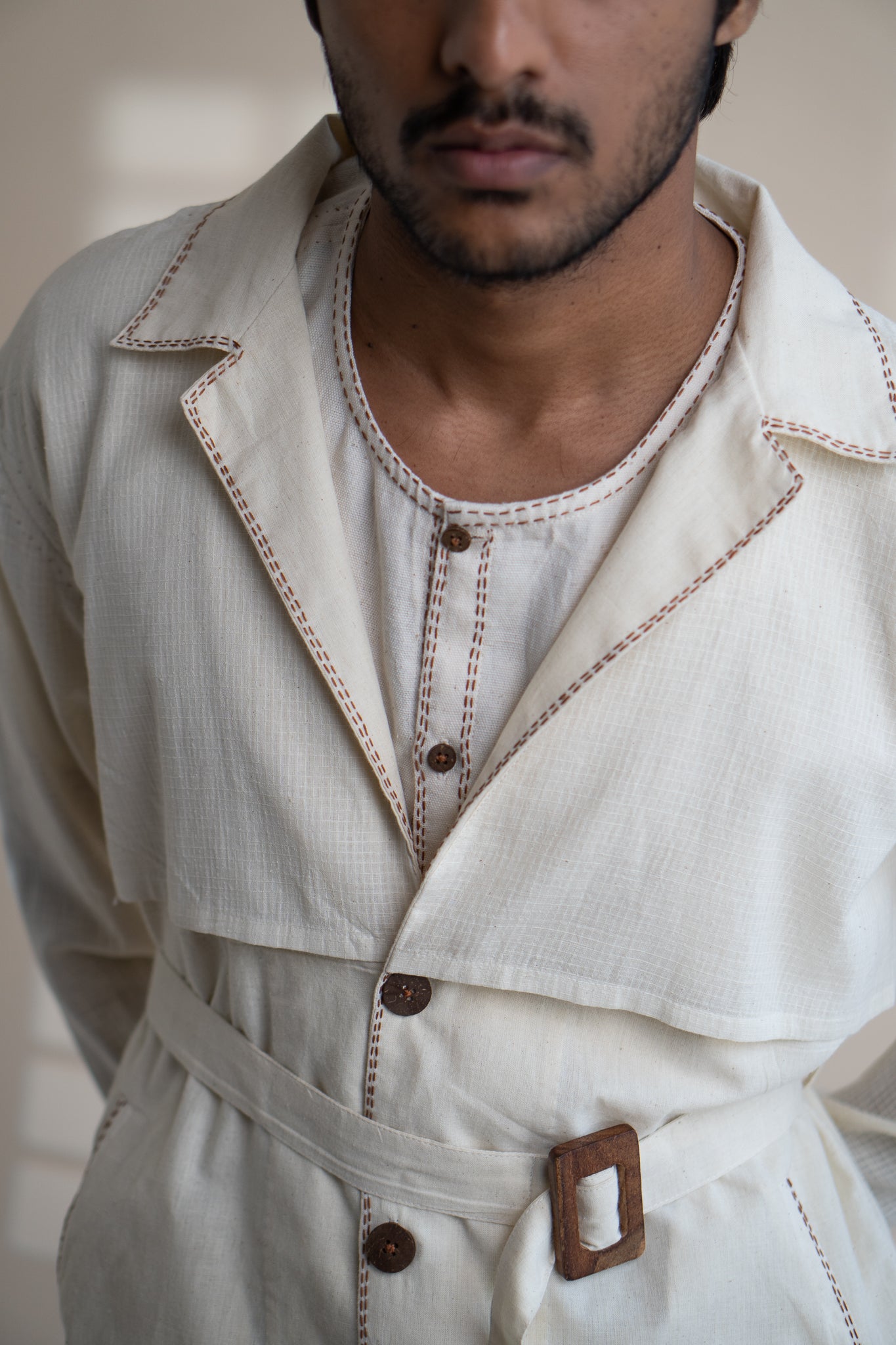 Dawning Trench Overlay at Kamakhyaa by Lafaani. This item is Beige, Casual Wear, Denim, Embroidered, For Him, Hand Woven Cotton, Kora, Mens Overlay, Menswear, Natural, Regular Fit, Trench Coats
