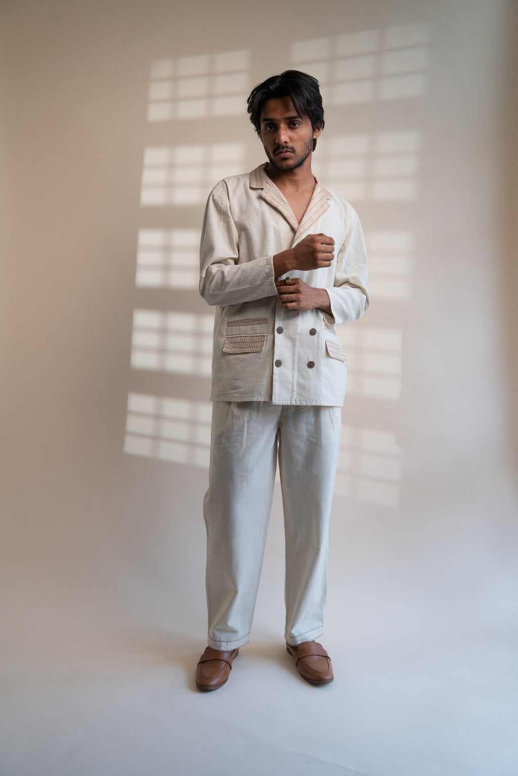Dawning Unisex Double Breasted Jacket & Pleated Pants Set at Kamakhyaa by Lafaani. This item is Beige, Bottoms, Casual Wear, Co-ord Sets, Denim, Embroidered, For Him, Hand Woven Cotton, Kora, Mens Co-ords, Menswear, Natural, Regular Fit, Unisex