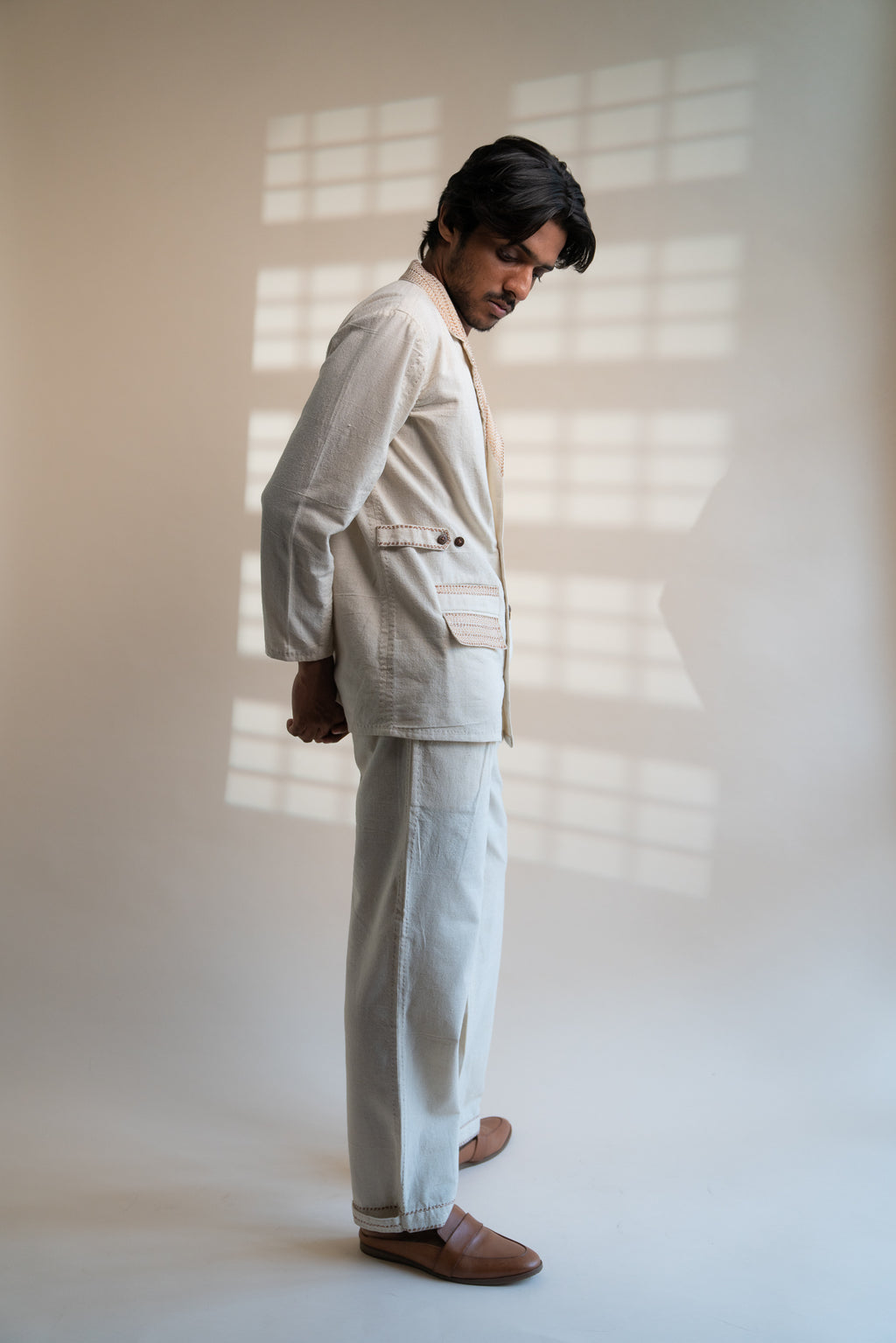 Dawning Unisex Double Breasted Jacket & Pleated Pants Set at Kamakhyaa by Lafaani. This item is Beige, Bottoms, Casual Wear, Co-ord Sets, Denim, Embroidered, For Him, Hand Woven Cotton, Kora, Mens Co-ords, Menswear, Natural, Regular Fit, Unisex