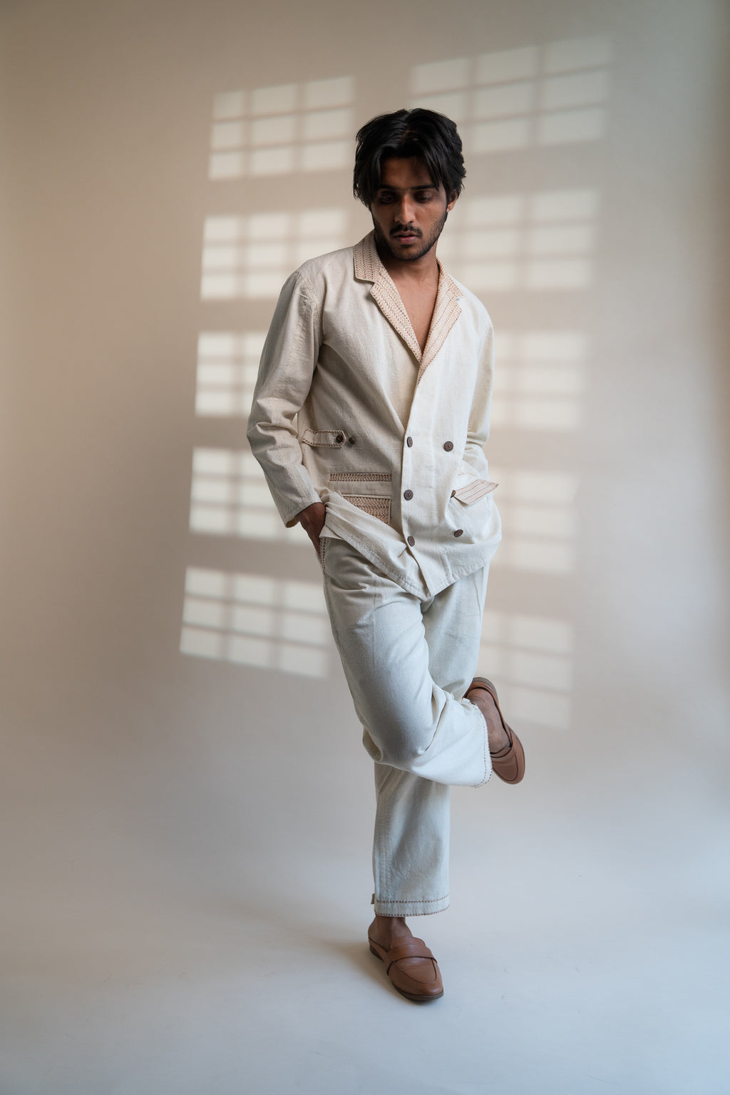 Dawning Unisex Double Breasted Jacket & Pleated Pants Set at Kamakhyaa by Lafaani. This item is Beige, Bottoms, Casual Wear, Co-ord Sets, Denim, Embroidered, For Him, Hand Woven Cotton, Kora, Mens Co-ords, Menswear, Natural, Regular Fit, Unisex