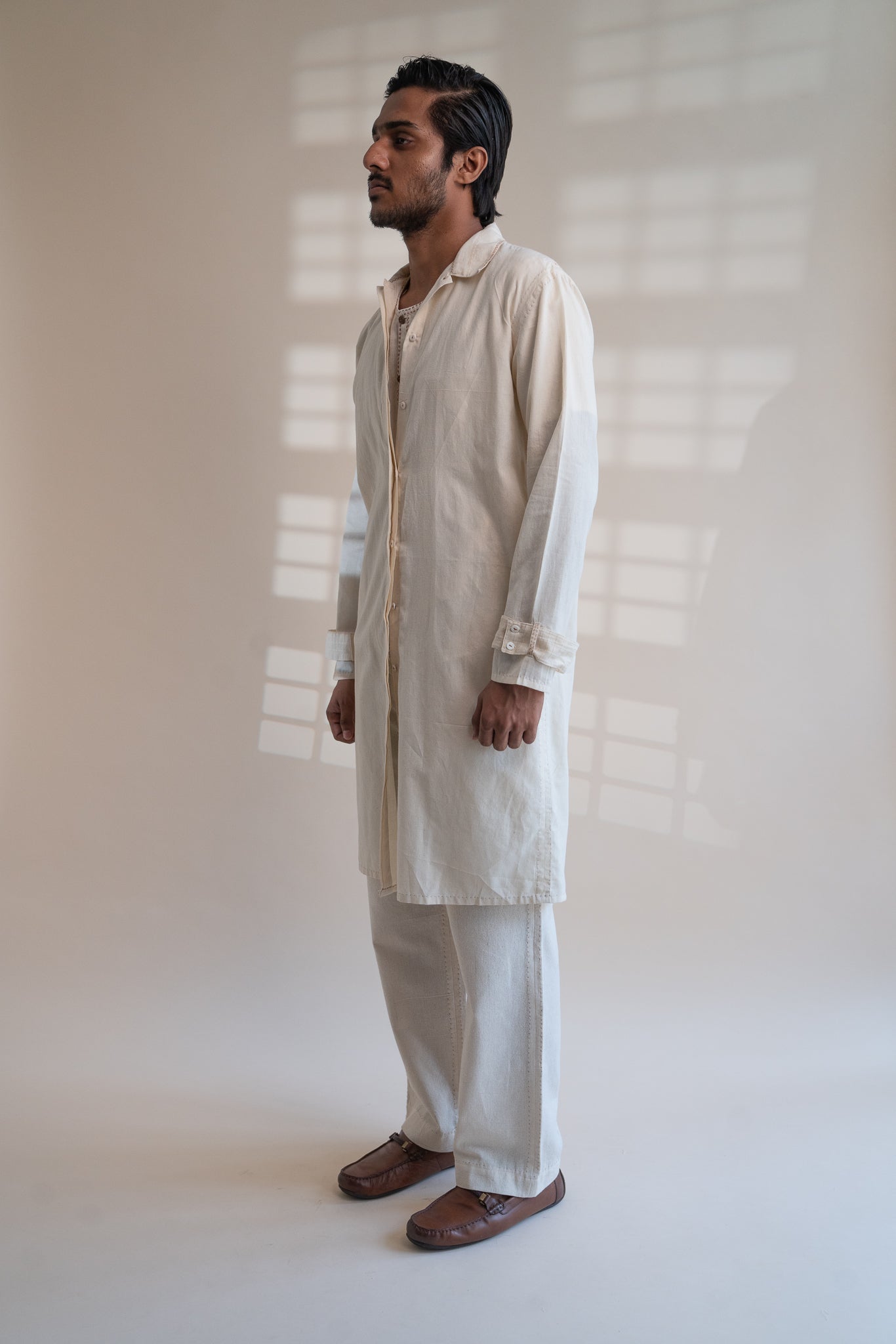Dawning Unisex Overlay at Kamakhyaa by Lafaani. This item is Beige, Casual Wear, Denim, Embroidered, For Him, Hand Woven Cotton, Kora, Mens Overlay, Menswear, Natural, Regular Fit, Trench Coats, Unisex