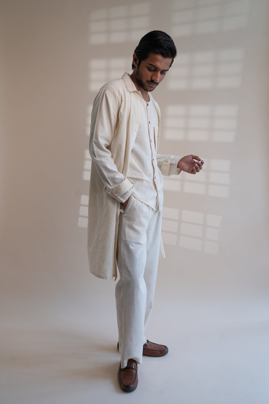 Dawning Unisex Overlay at Kamakhyaa by Lafaani. This item is Beige, Casual Wear, Denim, Embroidered, For Him, Hand Woven Cotton, Kora, Mens Overlay, Menswear, Natural, Regular Fit, Trench Coats, Unisex