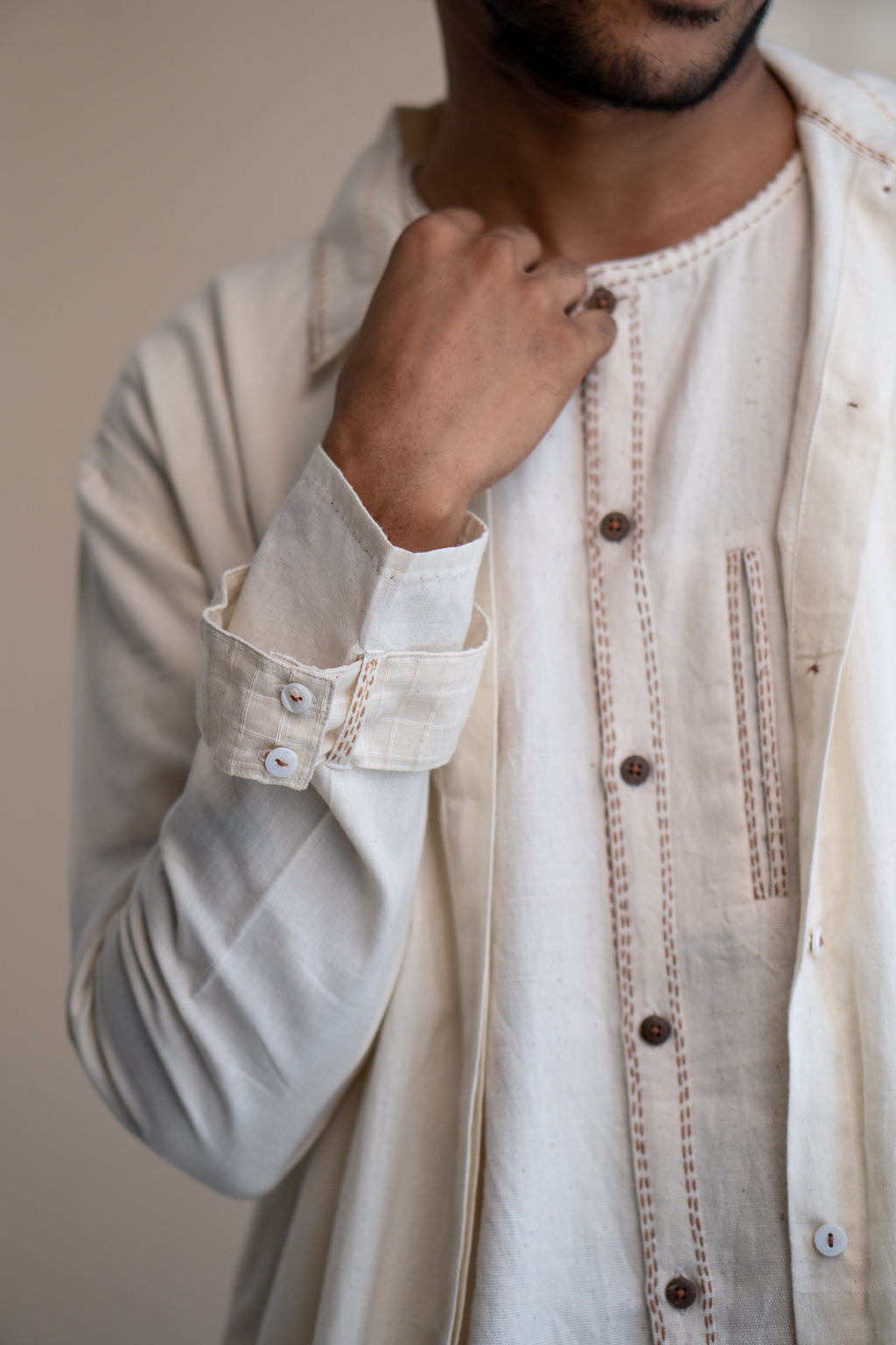 Dawning Unisex Overlay at Kamakhyaa by Lafaani. This item is Beige, Casual Wear, Denim, Embroidered, For Him, Hand Woven Cotton, Kora, Mens Overlay, Menswear, Natural, Regular Fit, Trench Coats, Unisex