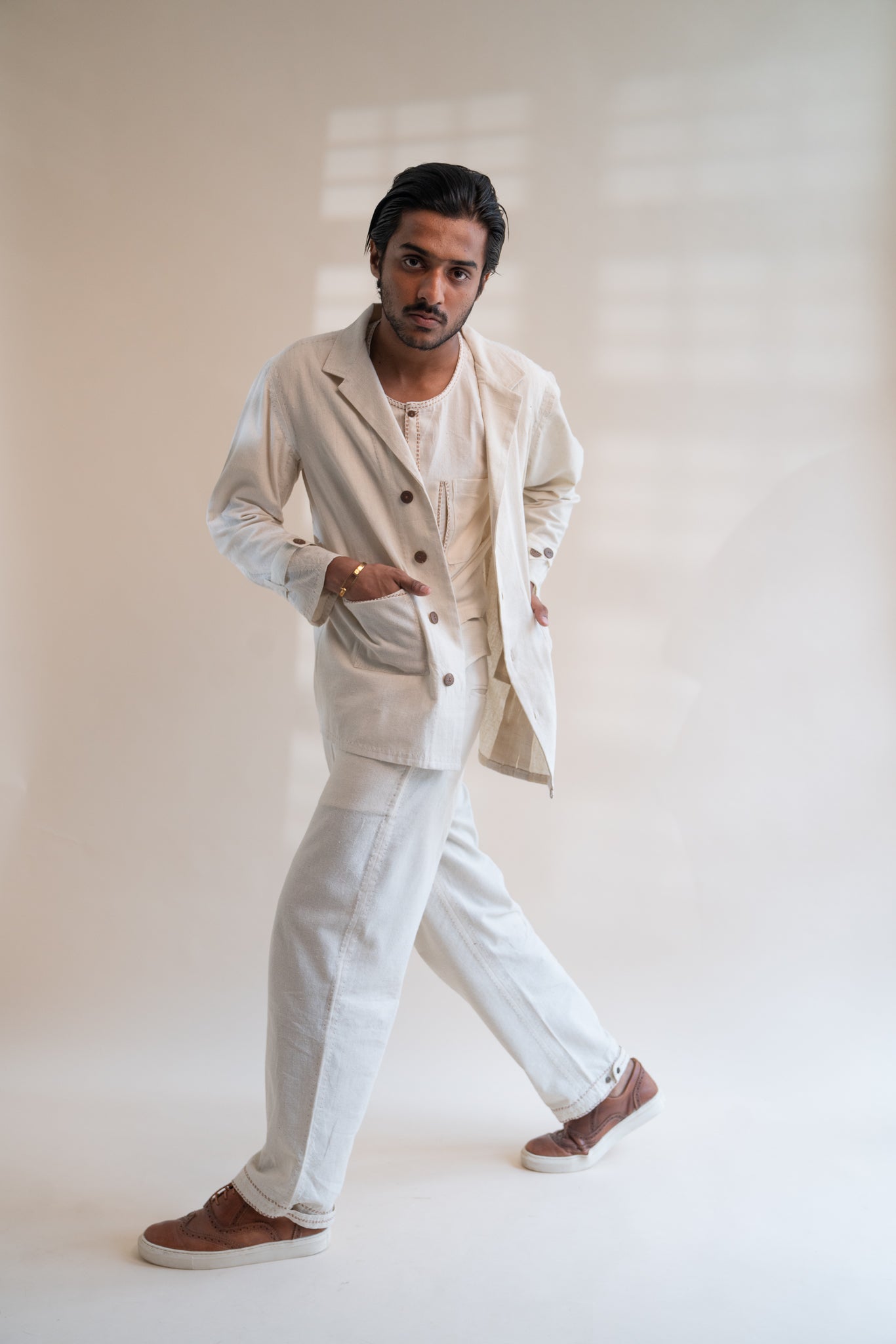 Dawning Unisex Pleated Blazer at Kamakhyaa by Lafaani. This item is Beige, Blazers, Casual Wear, Denim, Embroidered, For Him, Hand Woven Cotton, Kora, Mens Overlay, Menswear, Natural, Regular Fit, Unisex