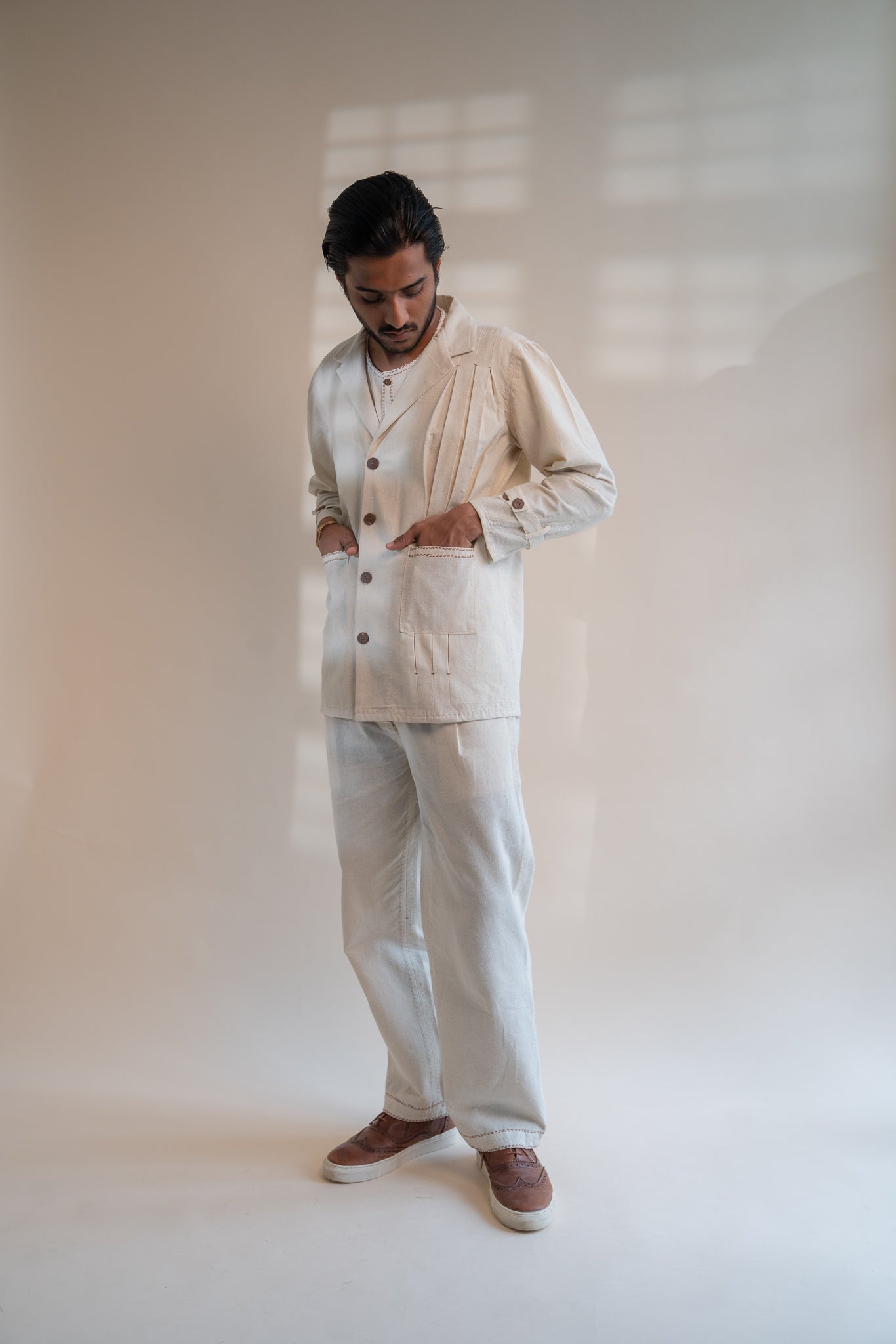 Dawning Unisex Pleated Blazer at Kamakhyaa by Lafaani. This item is Beige, Blazers, Casual Wear, Denim, Embroidered, For Him, Hand Woven Cotton, Kora, Mens Overlay, Menswear, Natural, Regular Fit, Unisex