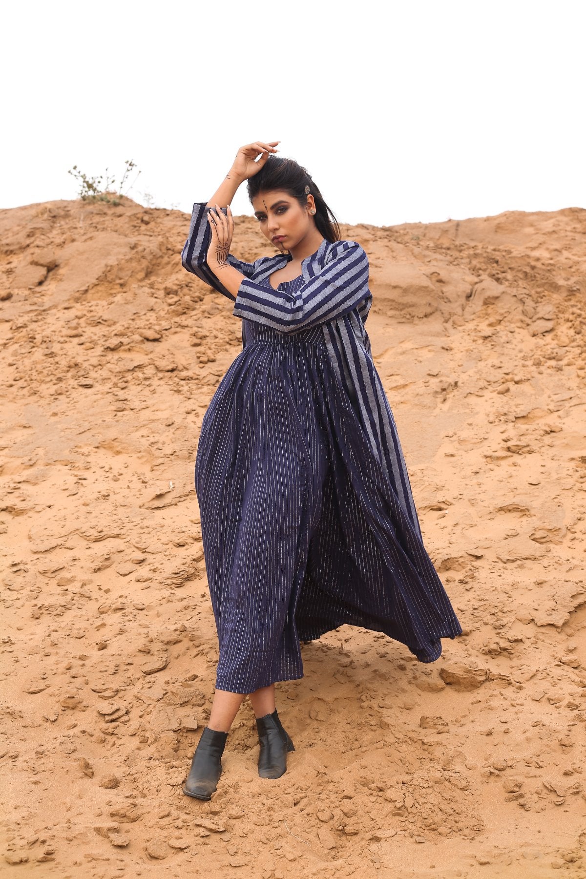 Deep Blue Striped Long Cape With Spagetti Dress - Set Of Two at Kamakhyaa by Keva. This item is Blue, Cape, Co-ord Sets, Cotton, Cotton Lurex, Desert Rose, Dress Sets, For Mother, For Mother W, Midi Dresses, Natural, Relaxed Fit, Resort Wear, Stripes, Womenswear