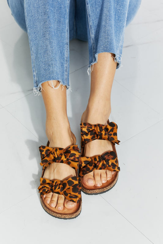Forever Link Fiercely Feminine Leopard Bow Slide Sandals at Kamakhyaa by Forever Link. This item is Black Friday, Faux Leather, Flats, Forever Link, Natural, Regular Fit, Ship from USA, Solids, TPR