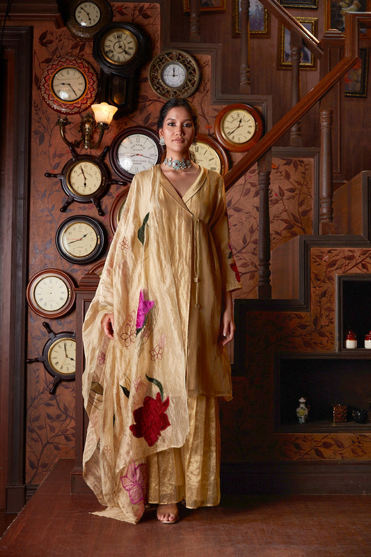 Gold Banarasi Silk Sharara With Velvet Applique Work at Kamakhyaa by Chambray & Co.. This item is Chambray & Co, Embroidered, Gold, Indian Wear, Natural, Party Wear, Regular Fit, Riwayat, Sharara and Gharara Sets, Silk, Womenswear