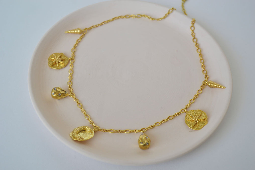 Gold Brass Galaxy Charm Necklaces at Kamakhyaa by The Loom Art. This item is Brass, Cosmic Dream TLA, Fashion Jewellery, For Daughter, Free Size, Gold, Gold Plated, jewelry, Natural, Necklaces