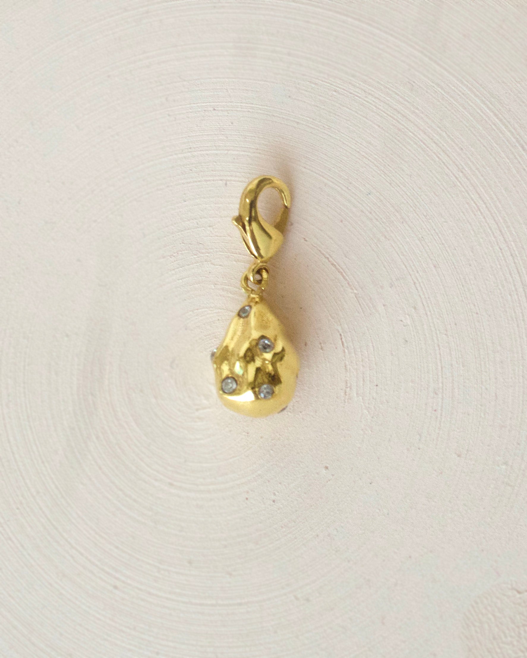 Gold Brass Studed Pearl Charm Pendants/Charm at Kamakhyaa by The Loom Art. This item is Brass, Cosmic Dream TLA, Fashion Jewellery, Free Size, Gold, Gold Plated, jewelry, Less than $50, Natural, Pendants, Products less than $25