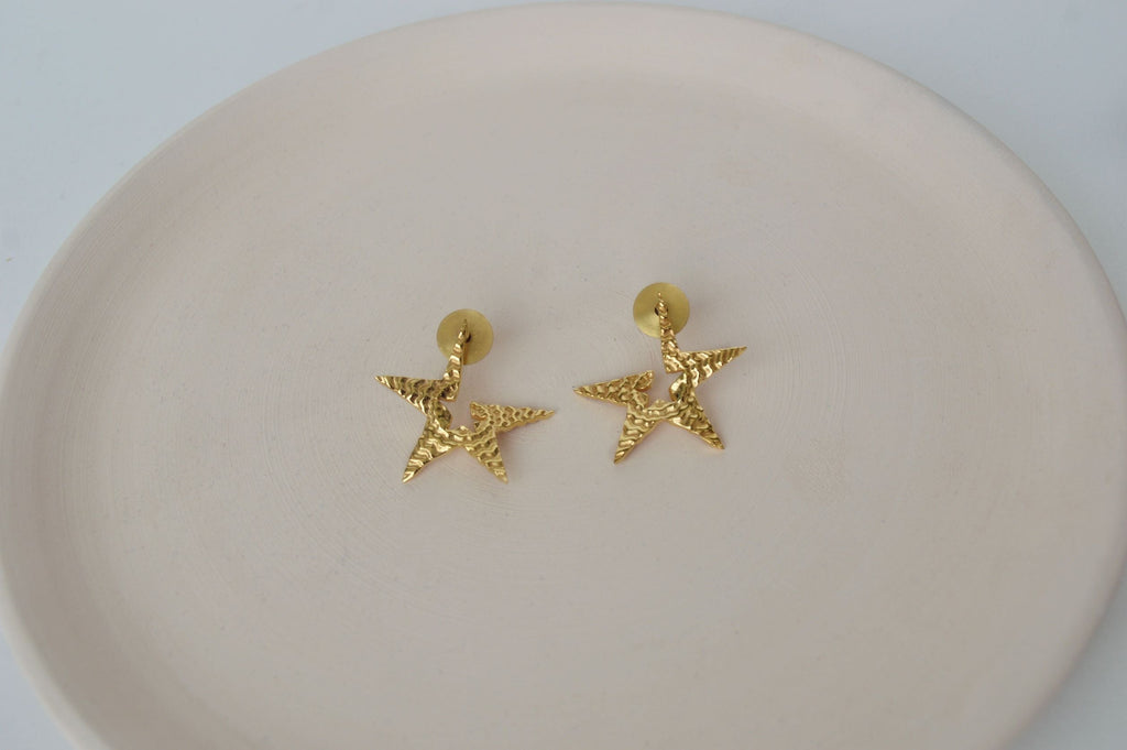 Gold Brass Tinted Star Studs at Kamakhyaa by The Loom Art. This item is Brass, Cosmic Dream TLA, Fashion Jewellery, Free Size, Gold, Gold Plated, jewelry, Less than $50, Natural, Office Wear Jewellery, Stud Earrings
