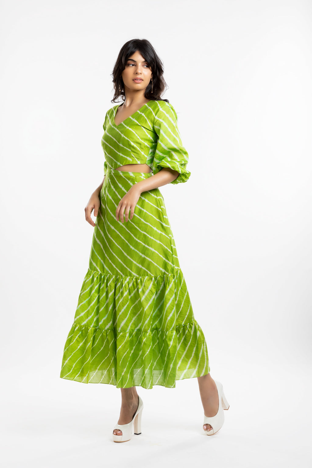 Green Cutout Dress at Kamakhyaa by House Of Ara. This item is Casual Wear, Chanderi, Cut Out Dresses, Green, Leheriya, Leheriya Collection, Maxi Dresses, Natural, Regular Fit, Silk, Stripes, Tiered Dresses, Womenswear