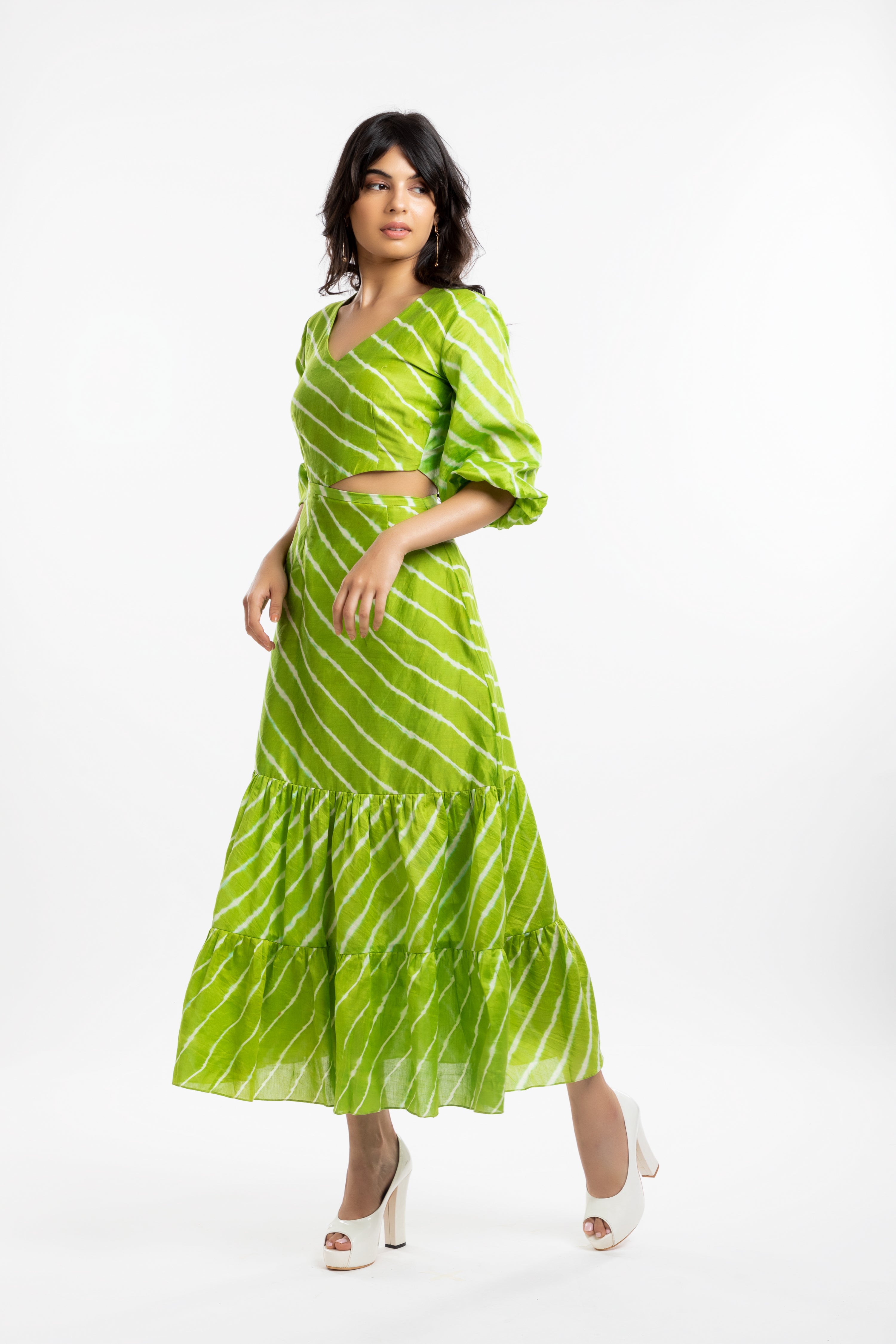 Green Cutout Dress at Kamakhyaa by House Of Ara. This item is Casual Wear, Chanderi, Cut Out Dresses, Green, Leheriya, Leheriya Collection, Maxi Dresses, Natural, Regular Fit, Silk, Stripes, Tiered Dresses, Womenswear