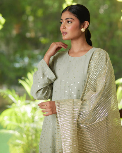 Green Gold Satin Silk Kurta Pant Set at Kamakhyaa by Mayura Kumar. This item is Casual Wear, Festive Wear, Gold, Green, Kurta Pant Sets, Mayura Kumar, Regular Fit, Satin, Silk, Silver, Solids, Timeless Elegance, Womenswear