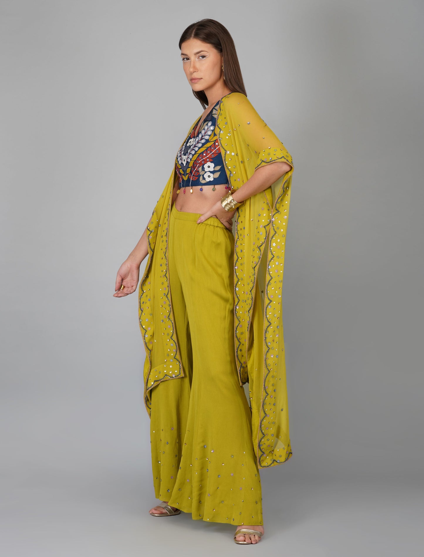 Green Hand Embroidered Applique Blouse Cape Set at Kamakhyaa by Devyani Mehrotra. This item is Chanderi Silk, Co-ord Sets, Embroidered, Festive Wear, Fitted at Bust, Georgette, Green, Natural, Patchwork, Pre Spring 2023, Solids, Vacation Co-ords, Womenswear
