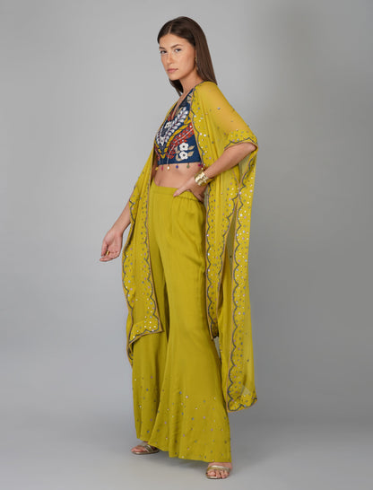 Green Hand Embroidered Applique Blouse Cape Set at Kamakhyaa by Devyani Mehrotra. This item is Chanderi Silk, Co-ord Sets, Embroidered, Festive Wear, Fitted at Bust, Georgette, Green, Natural, Patchwork, Pre Spring 2023, Solids, Vacation Co-ords, Womenswear