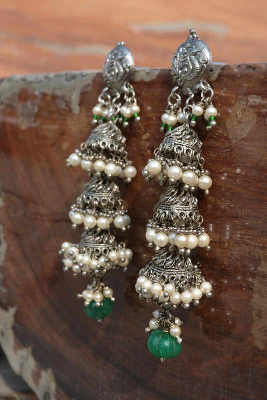 Green Jhumkas Peacock at Kamakhyaa by House Of Heer. This item is Alloy Metal, Festive Jewellery, Festive Wear, Free Size, Green, jewelry, Jhumkas, July Sale, July Sale 2023, Long Earrings, Multicolor, Natural, Pearl, Solids, Textured
