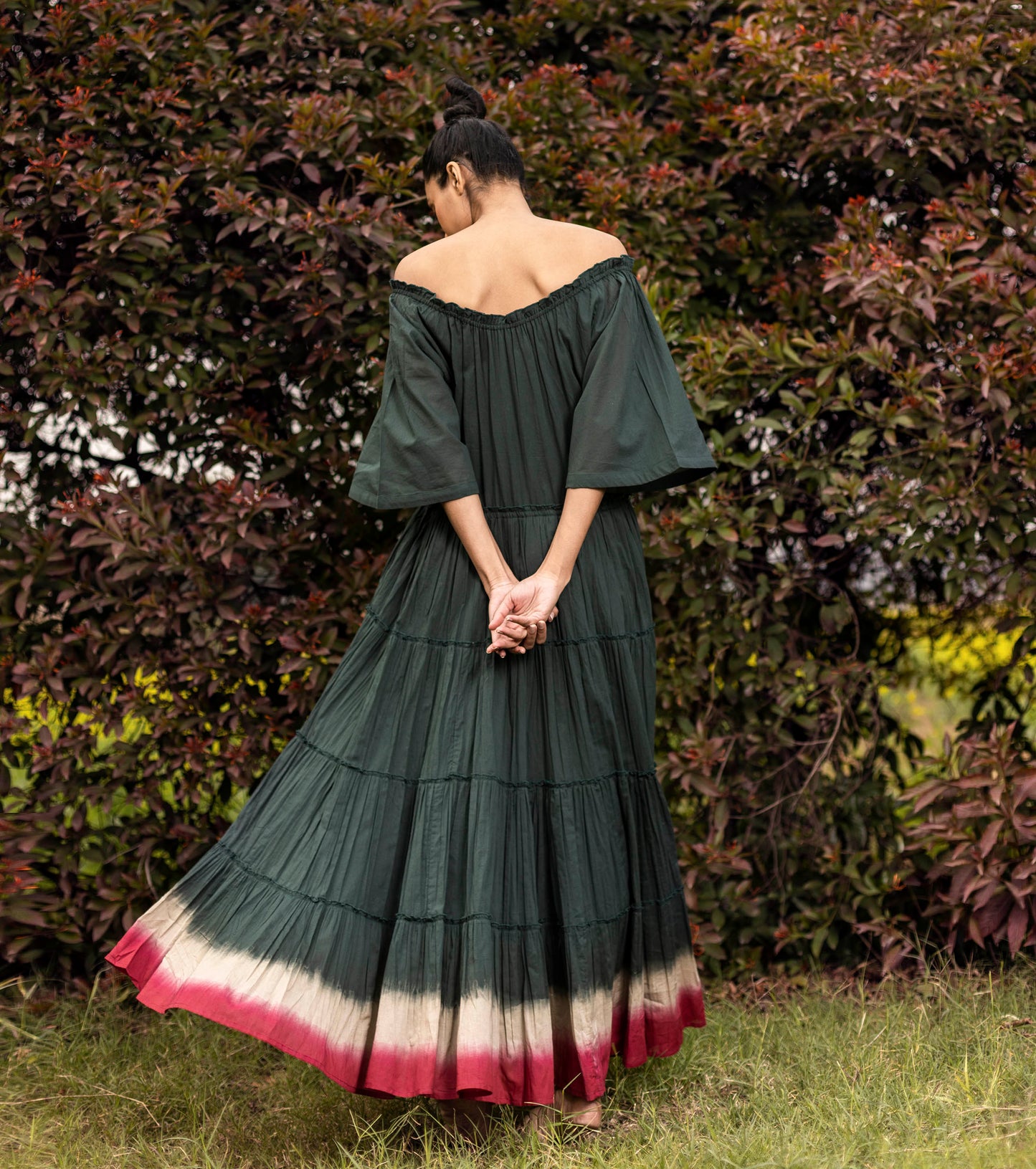 Green Maxi Dress with Pockets at Kamakhyaa by Khara Kapas. This item is Best Selling, Green, Lost & Found, Maxi Dresses, Mulmul, Natural, Off-Shoulder Dresses, Ombre & Dyes, Regular Fit, Resort Wear, Solid Selfmade, Tiered Dresses, Womenswear