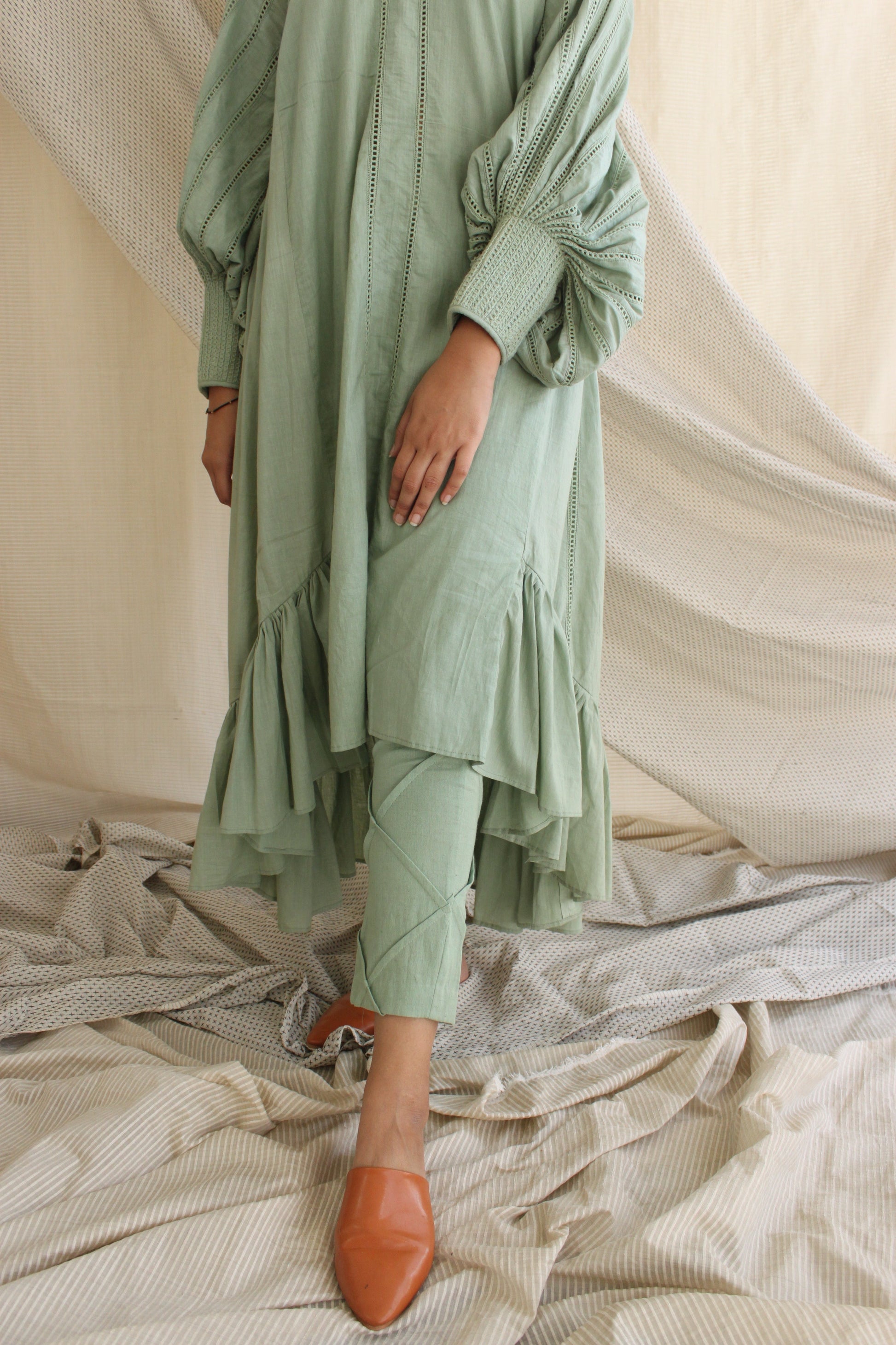 Green Ruffled Full Sleeves Dress at Kamakhyaa by Chambray & Co.. This item is Casual Wear, Cotton, Green, Midi Dresses, Natural, Regular Fit, Ruffle Dresses, Solid Selfmade, Solids, Tiered Dresses, Womenswear