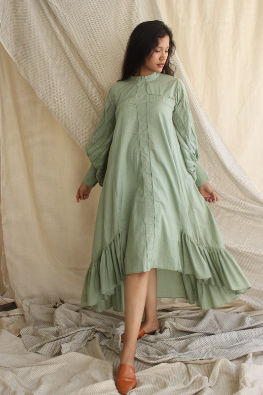 Green Ruffled Full Sleeves Dress at Kamakhyaa by Chambray & Co.. This item is Casual Wear, Cotton, Green, Midi Dresses, Natural, Regular Fit, Ruffle Dresses, Solid Selfmade, Solids, Tiered Dresses, Womenswear