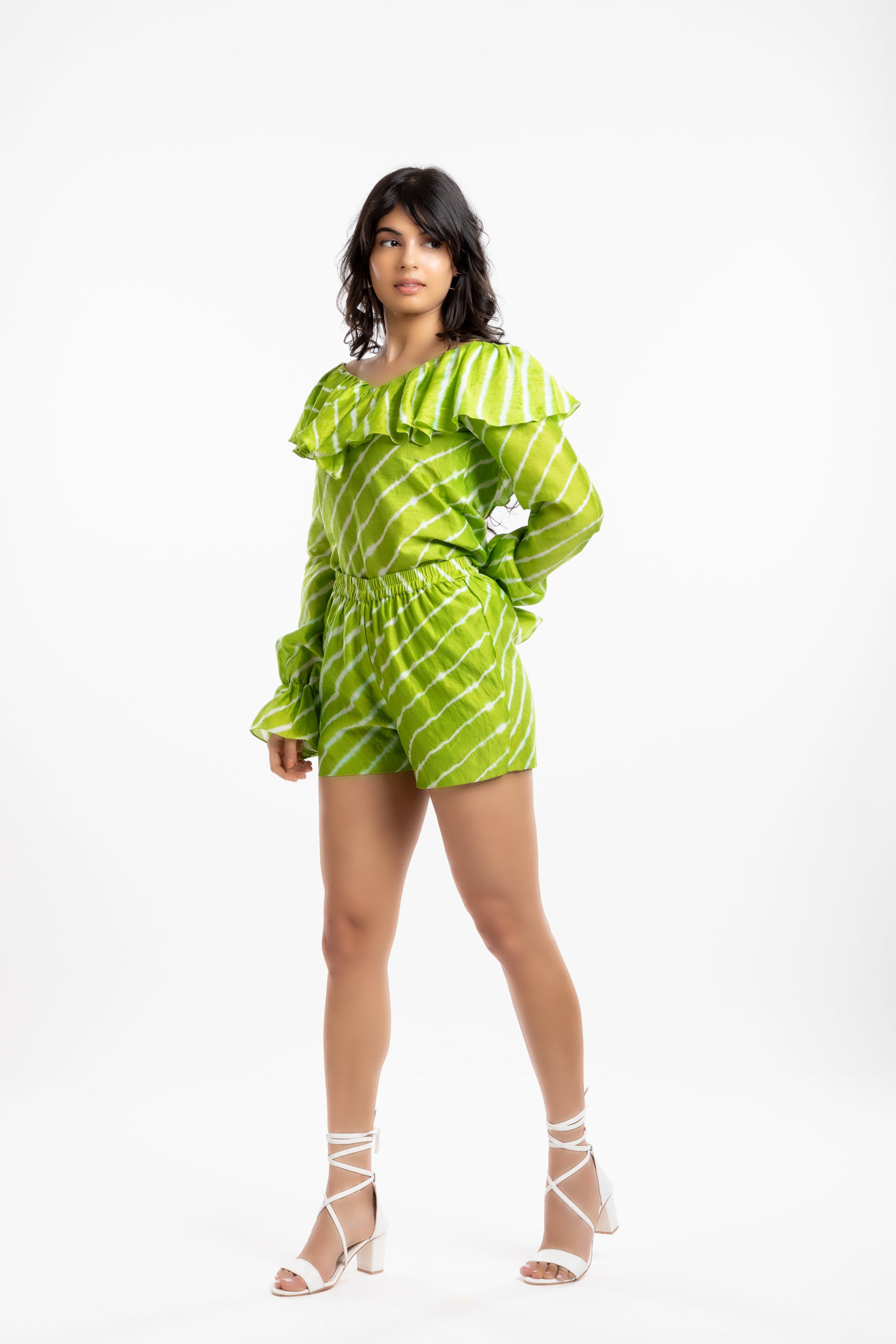 Green Ruffled Tops at Kamakhyaa by House Of Ara. This item is Casual Wear, Chanderi, Green, Leheriya, Leheriya Collection, Natural, Off-shoulder Tops, Regular Fit, Ruffle Tops, Stripes, Womenswear