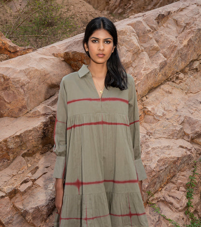 Green Shibori dyed Mini Dress at Kamakhyaa by Khara Kapas. This item is 32 Days, Cotton, Earth Party, For Her, Green, Mini Dresses, Mulmul, Natural, Ombre & Dyes, Printed Selfsame, Relaxed Fit, Resort Wear, Tiered Dresses, Womenswear