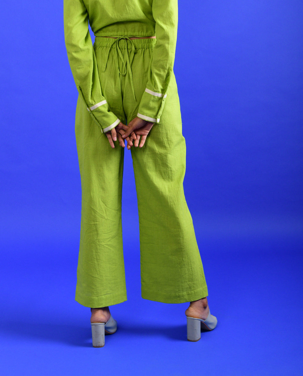 Green Solid Pants at Kamakhyaa by Rias Jaipur. This item is 100% Organic Cotton, Casual Wear, Green, Handspun, Handwoven, Hue, Pants, Regular Fit, Stripes, Womenswear