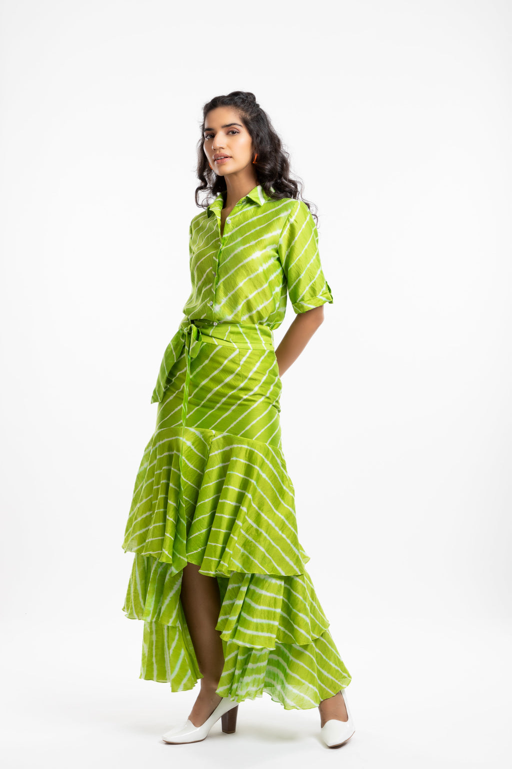 Green Tiered Ruffled Skirt at Kamakhyaa by House Of Ara. This item is Casual Wear, Chanderi, Fitted at Waist, Green, Leheriya, Leheriya Collection, Maxi Skirts, Natural, Prints, Skirts, Stripes, Womenswear