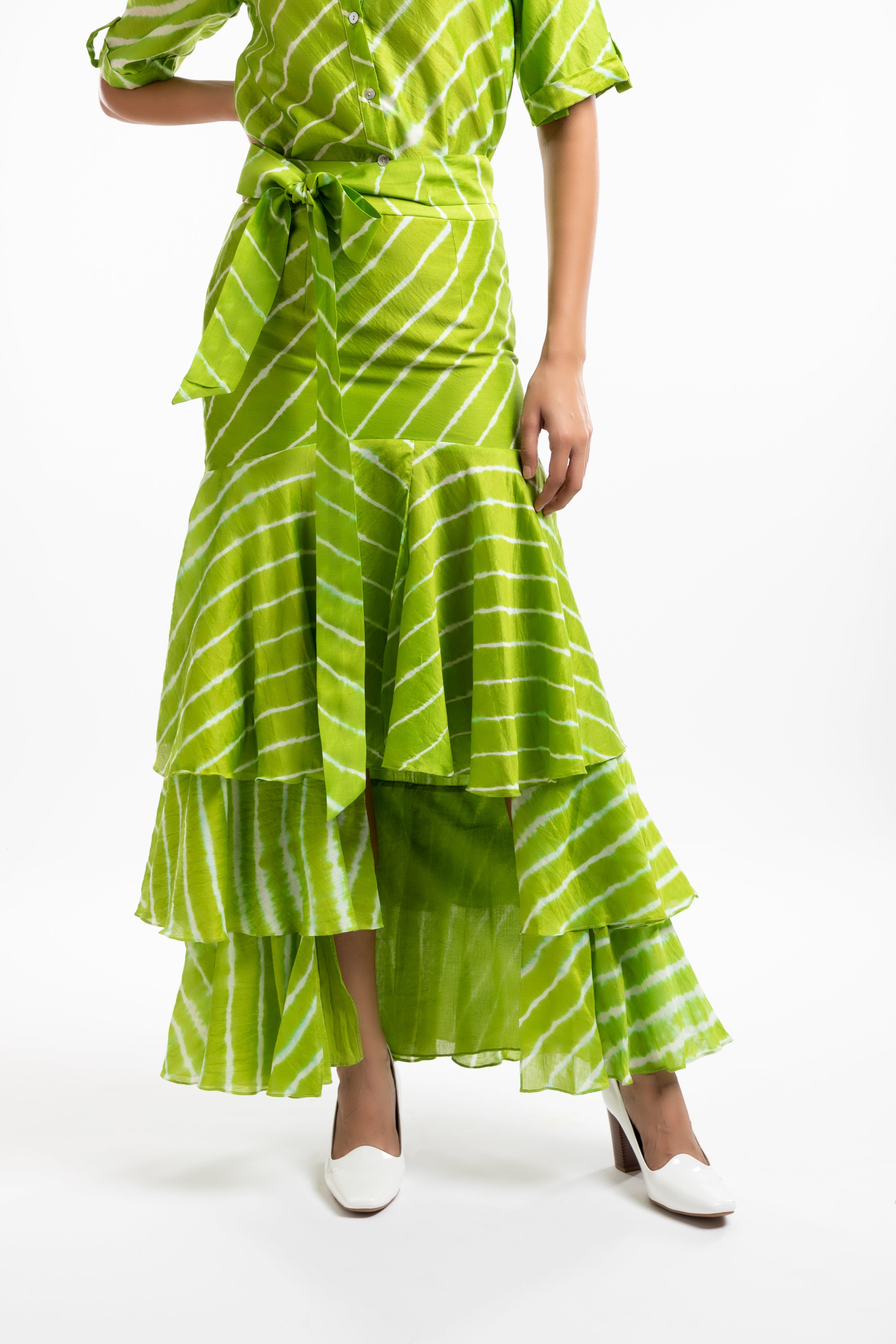 Green Tiered Ruffled Skirt at Kamakhyaa by House Of Ara. This item is Casual Wear, Chanderi, Fitted at Waist, Green, Leheriya, Leheriya Collection, Maxi Skirts, Natural, Prints, Skirts, Stripes, Womenswear