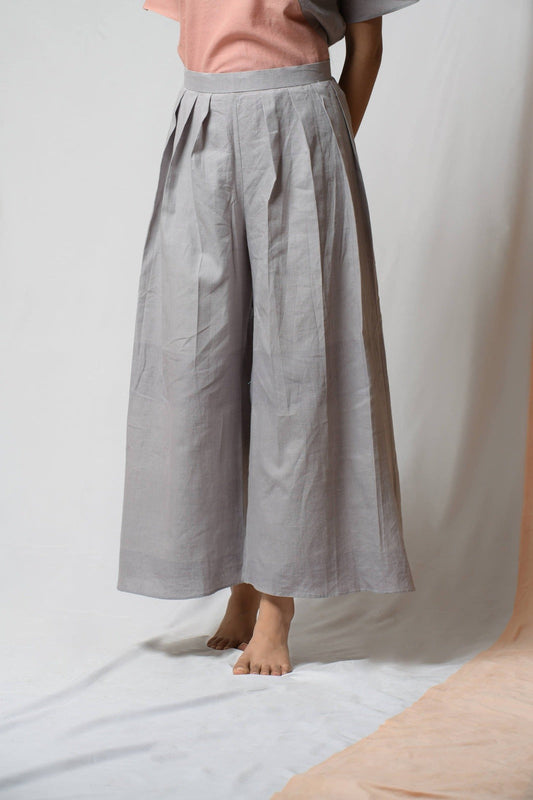 Grey Cotton Khadi Pants at Kamakhyaa by Niraa. This item is Casual Wear, Cotton khadi, Grey, Natural with azo dyes, Palazzo Pants, Relaxed Fit, Solids, Tales of rippling brooks, Womenswear