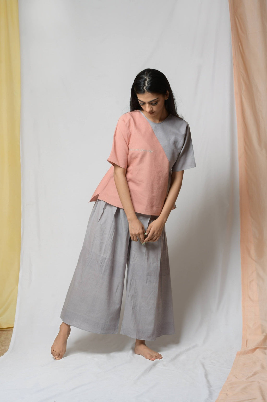 Grey Cotton Khadi Pants at Kamakhyaa by Niraa. This item is Casual Wear, Cotton khadi, Grey, Natural with azo dyes, Palazzo Pants, Relaxed Fit, Solids, Tales of rippling brooks, Womenswear