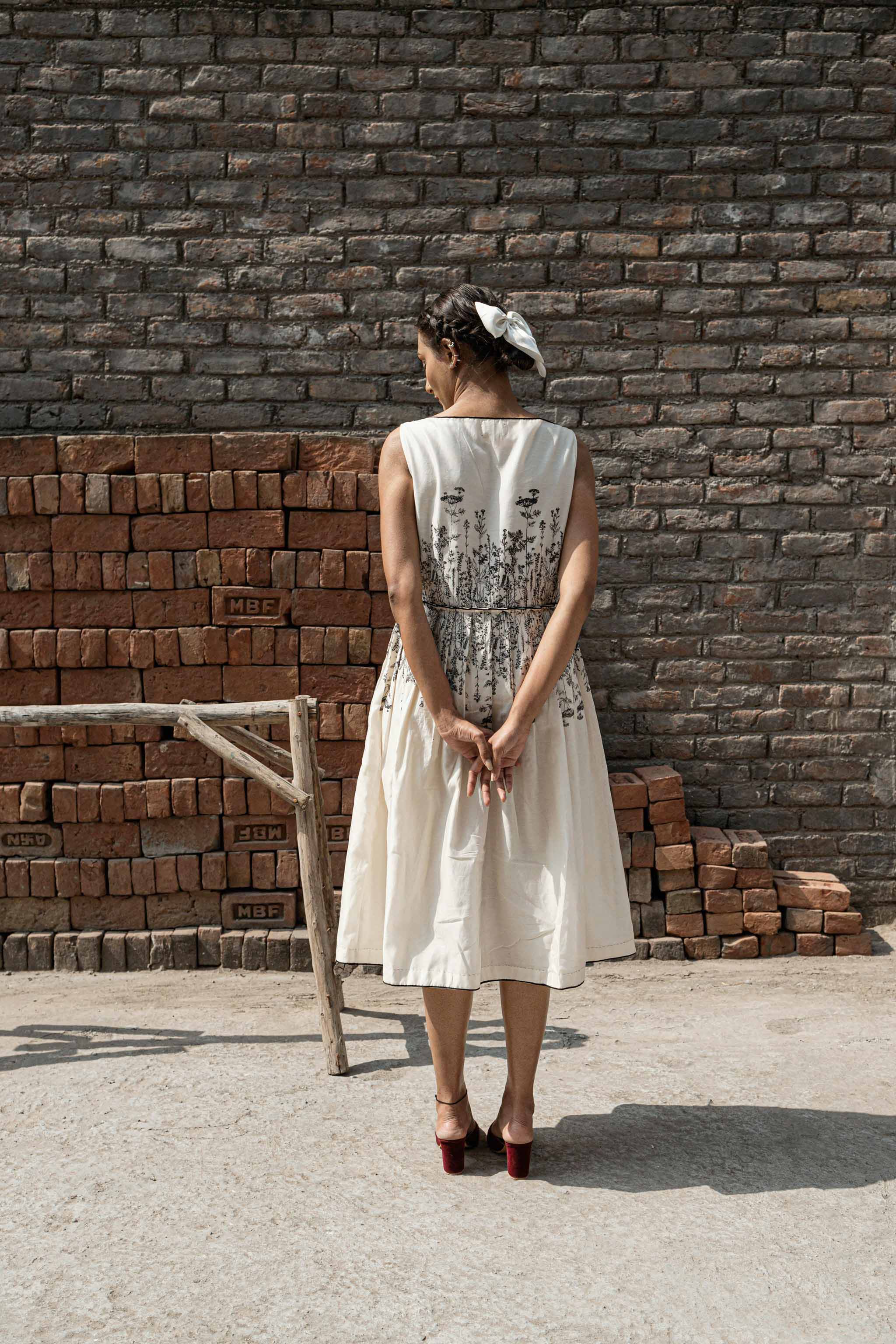 Ivory Knife Pleat Dress at Kamakhyaa by Ahmev. This item is Best Selling, Casual Wear, Chanderi, FB ADS JUNE, Ink And Ivory, Midi Dresses, Natural, Prints, Regular Fit, Sleeveless Dresses, White, Womenswear