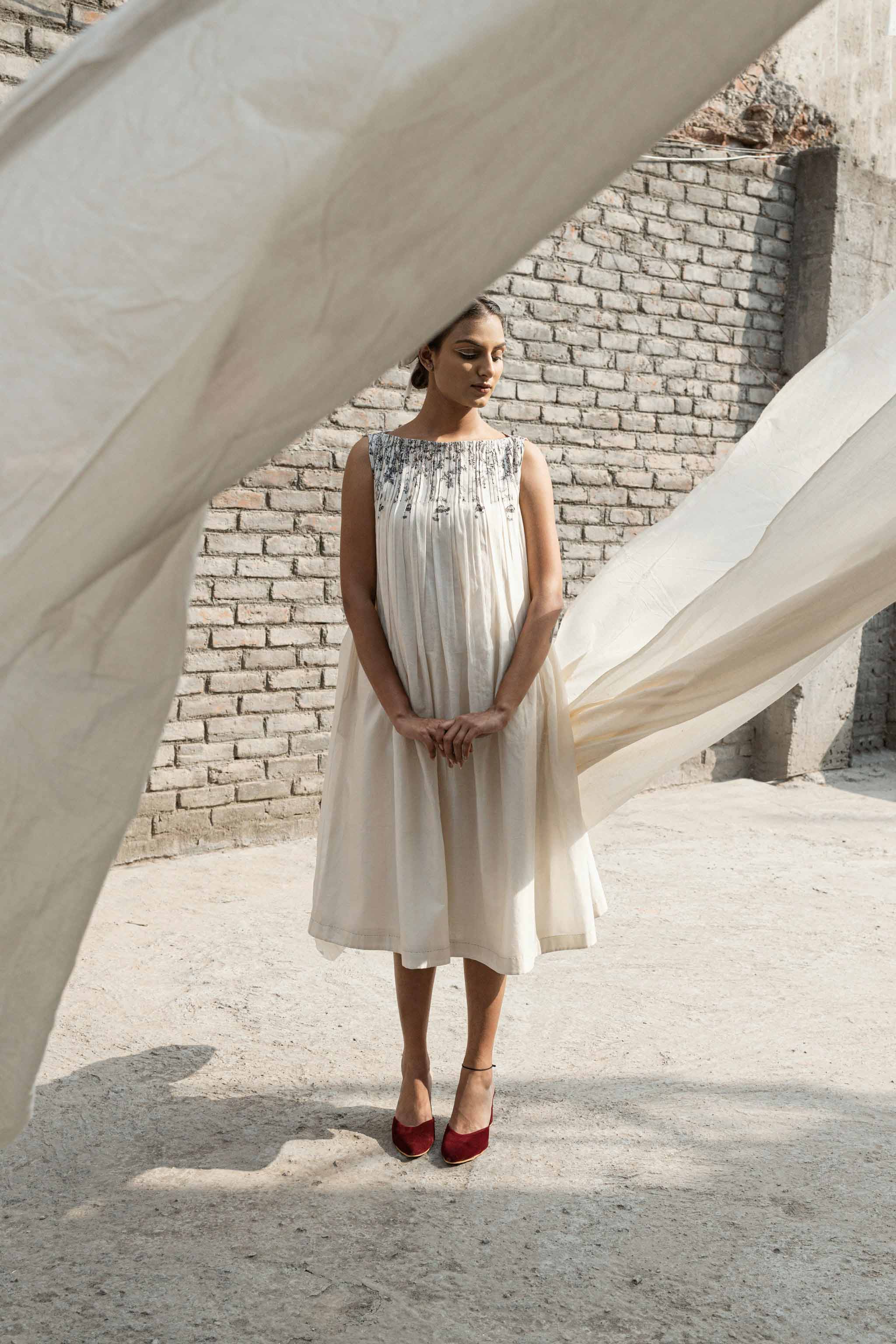 Ivory Pleated Neck Dress at Kamakhyaa by Ahmev. This item is Casual Wear, Chanderi, Ink And Ivory, Midi Dresses, Natural, Prints, Regular Fit, Sleeveless Dresses, White, Womenswear